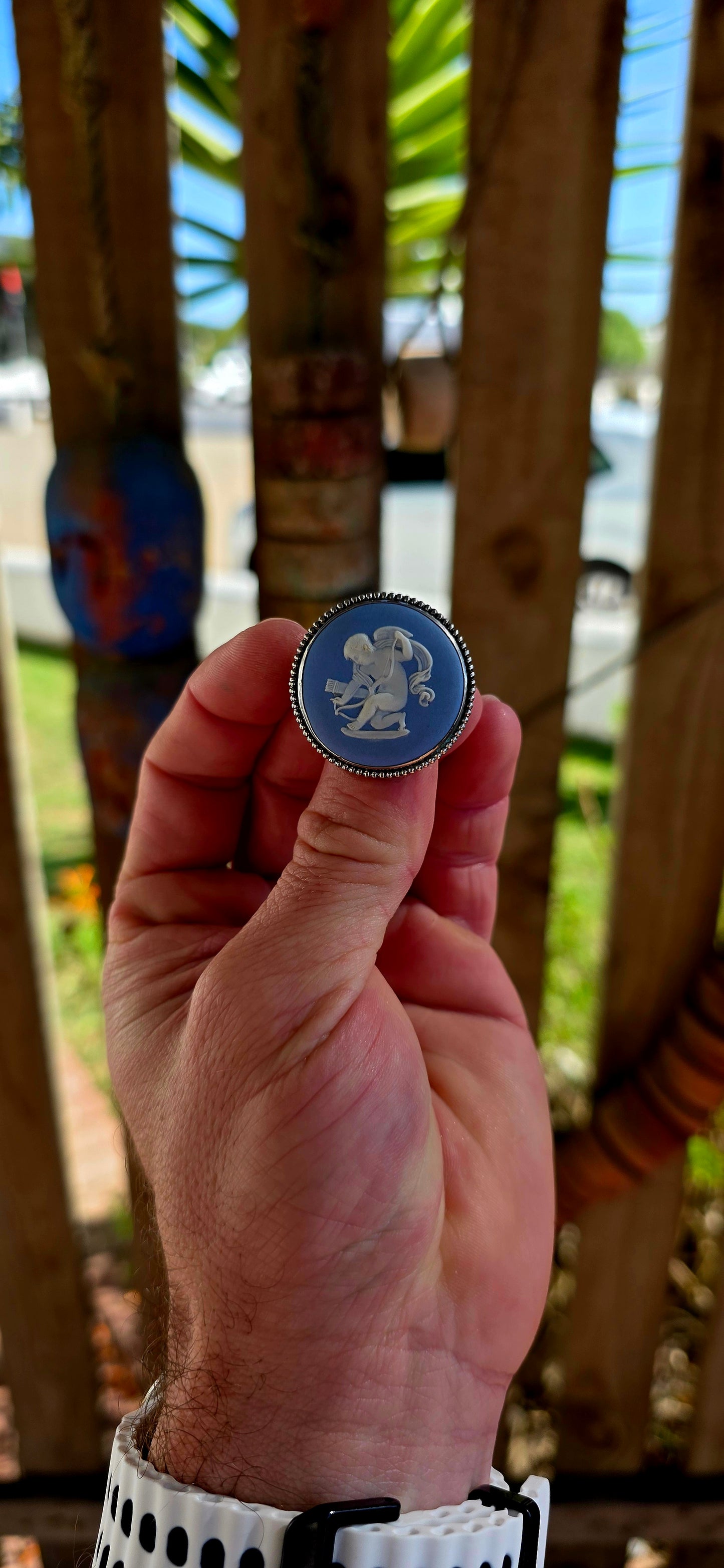 A beautiful vintage sterling silver and Wedgwood jasperware brooch, featuring a classic baby blue jasperware panel adorned with a finely detailed white embossed cherub.