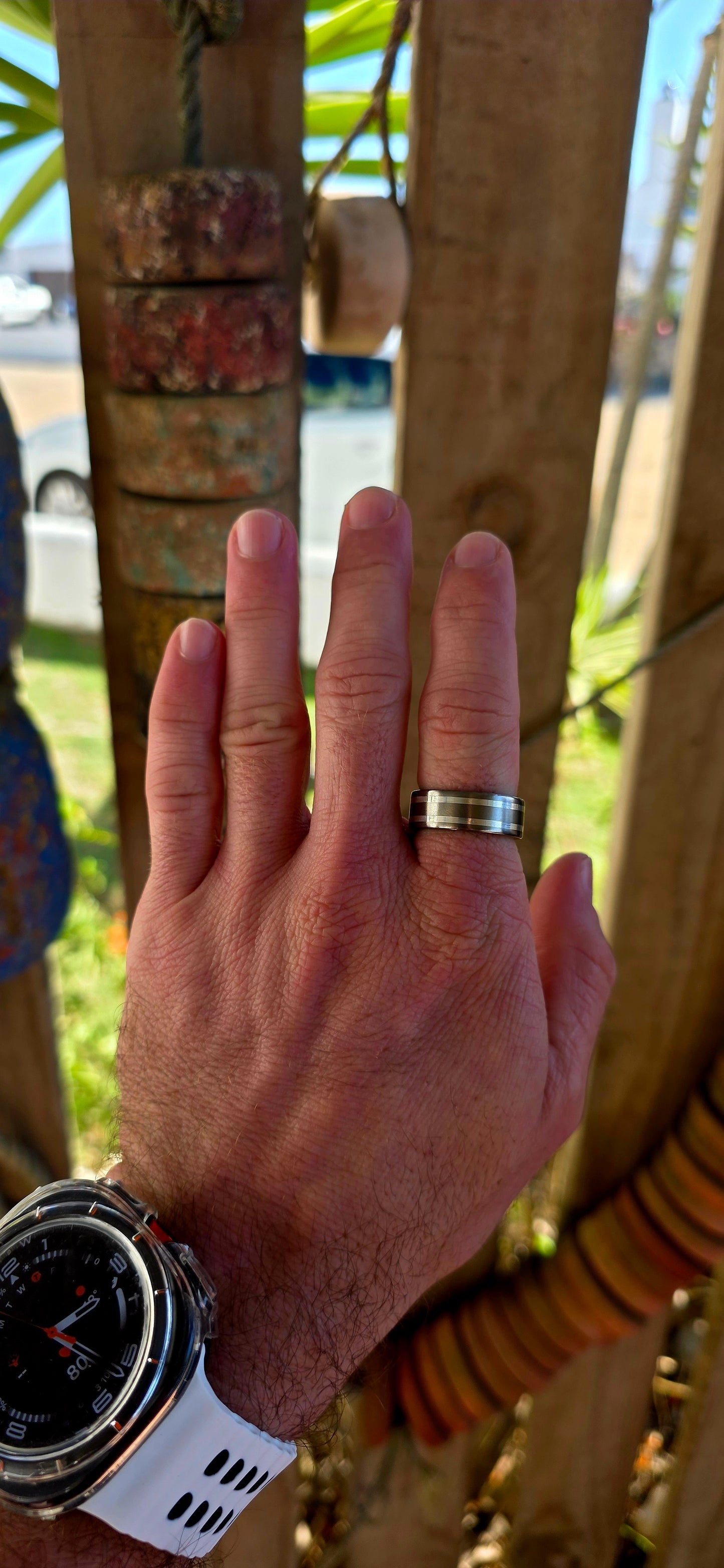 An artisan-crafted titanium and sterling silver ring, designed in a timeless D-shaped band that sits comfortably on the finger with that perfect solid feel.