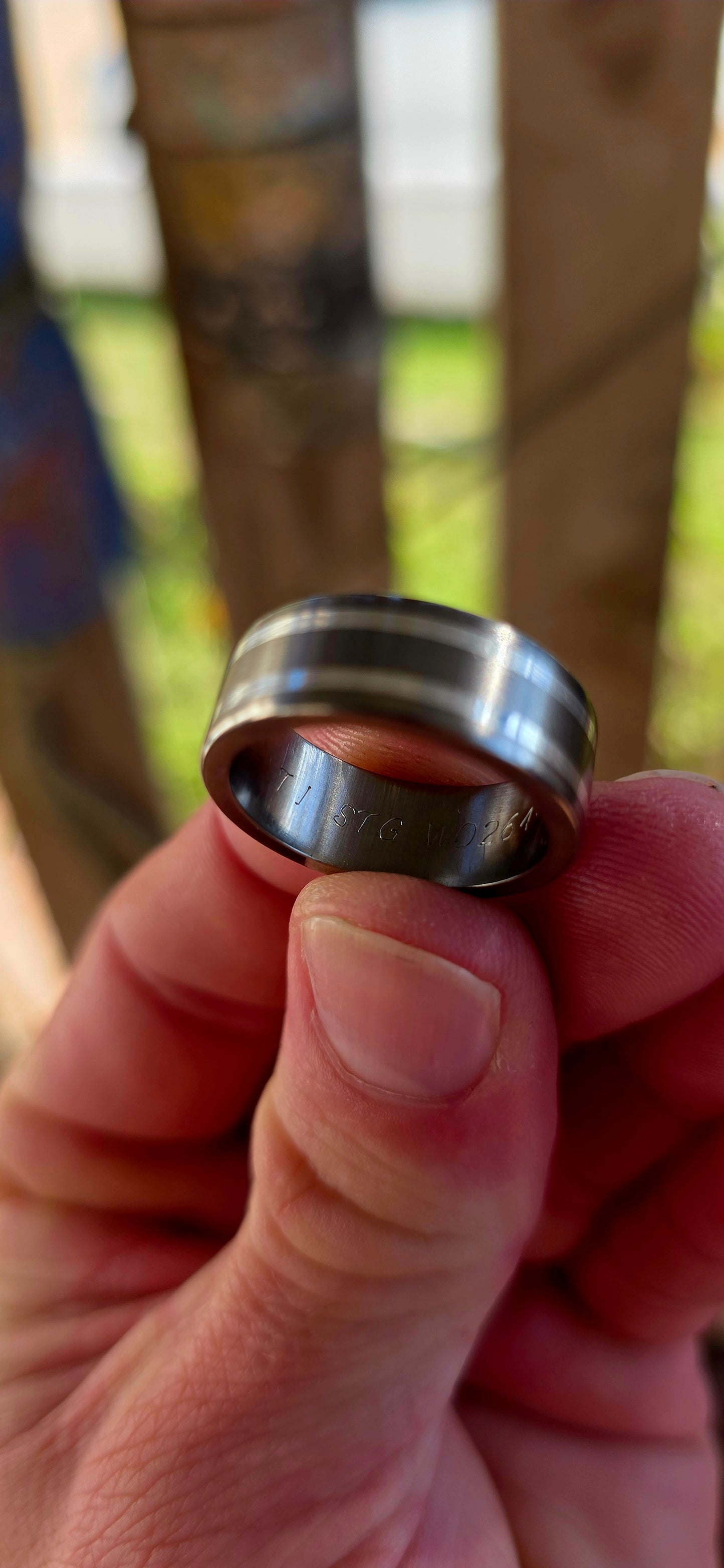 An artisan-crafted titanium and sterling silver ring, designed in a timeless D-shaped band that sits comfortably on the finger with that perfect solid feel.