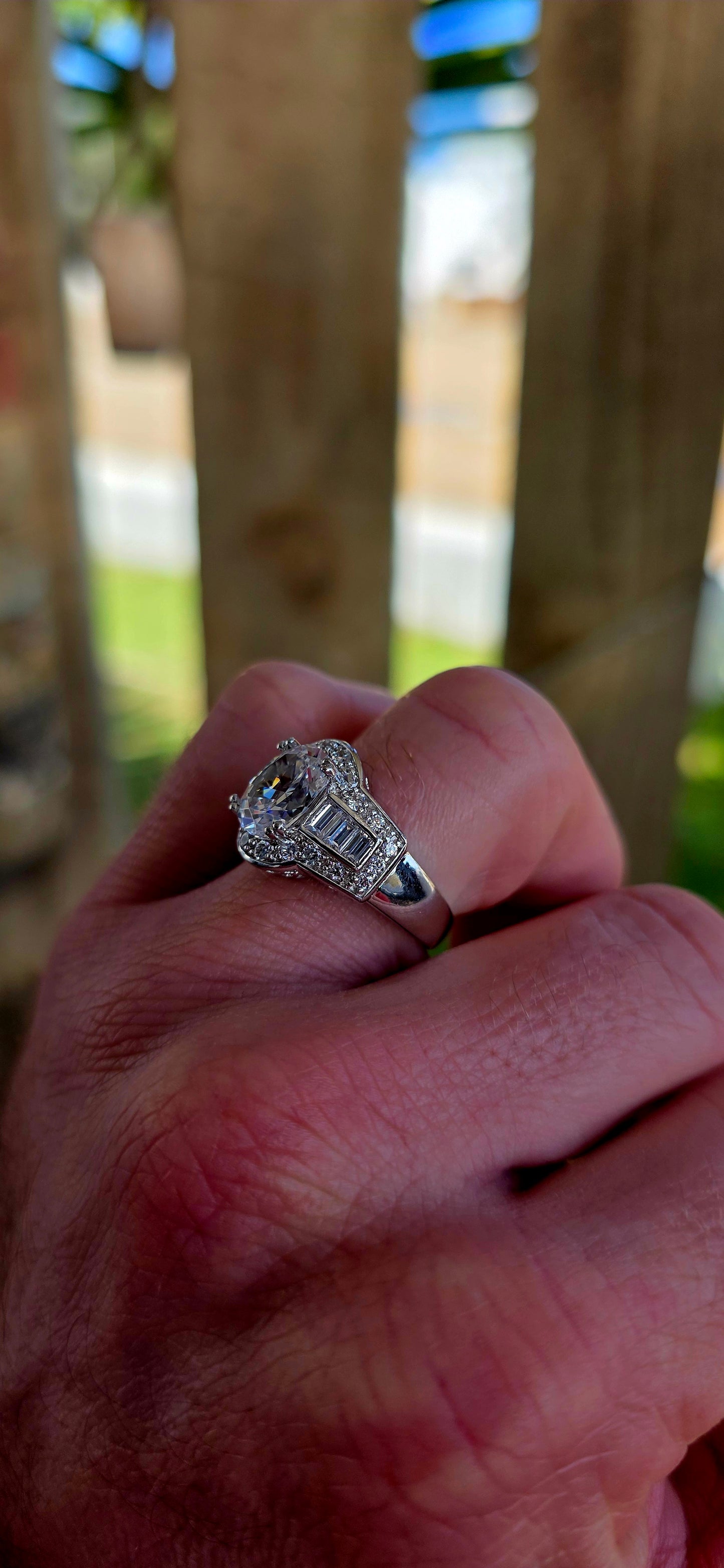 A high-quality designer-crafted sterling silver dress ring, set with a large oval-cut cubic zirconia at the centre, elevated in elegant prong settings to maximise light and sparkle.