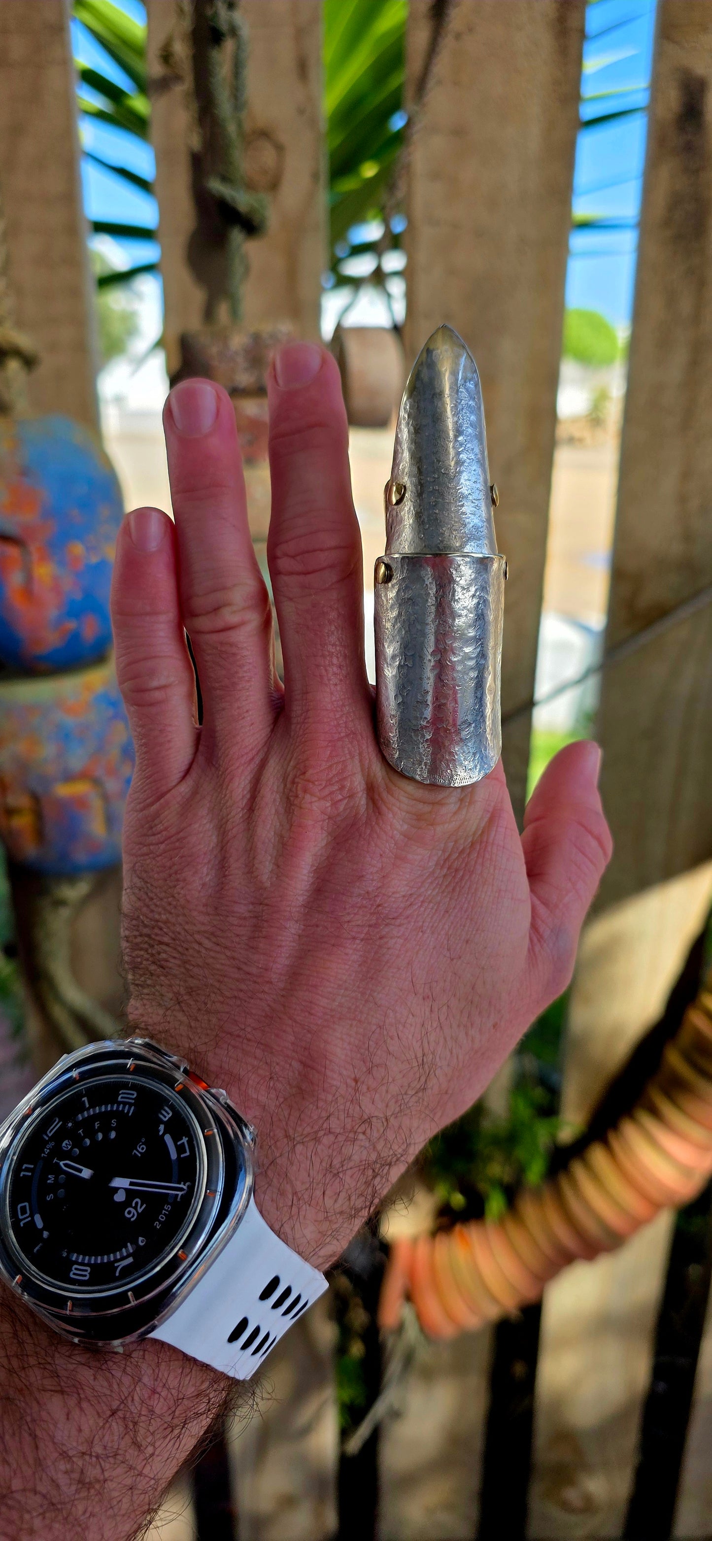 A chunky and seriously striking vintage artisan-made full finger armour ring, crafted in silver plating with contrasting brass rivet accents.