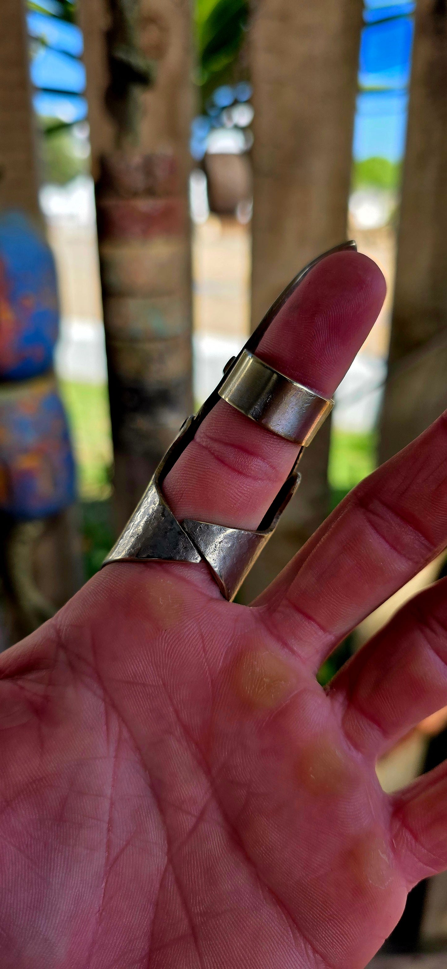 A chunky and seriously striking vintage artisan-made full finger armour ring, crafted in silver plating with contrasting brass rivet accents.