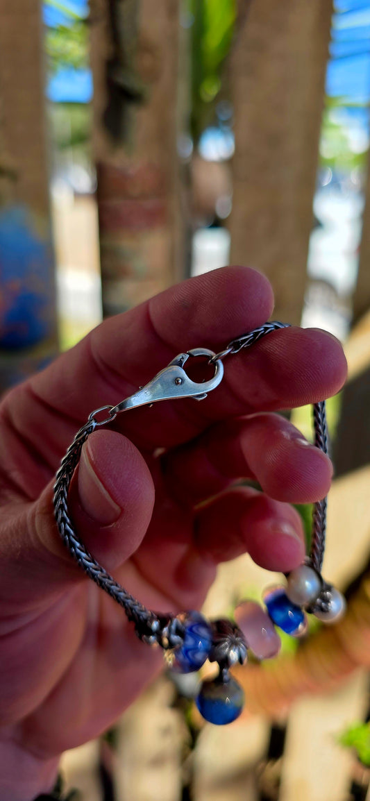 This one is pure magic on the wrist… a beautifully curated Trollbeads bracelet that feels like it was pulled straight from an enchanted shoreline