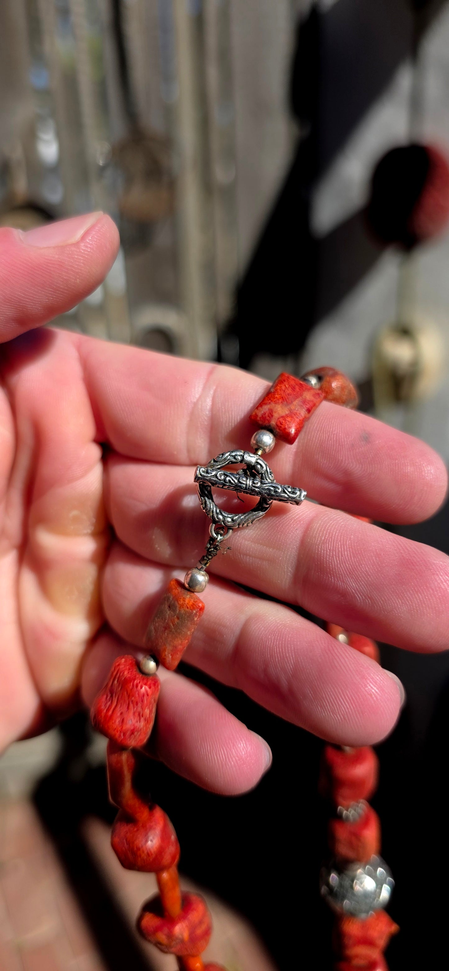 This chunky artisan-made necklace is crafted in solid sterling silver and strung with beautifully irregular, semi-polished natural Mediterranean coral beads.