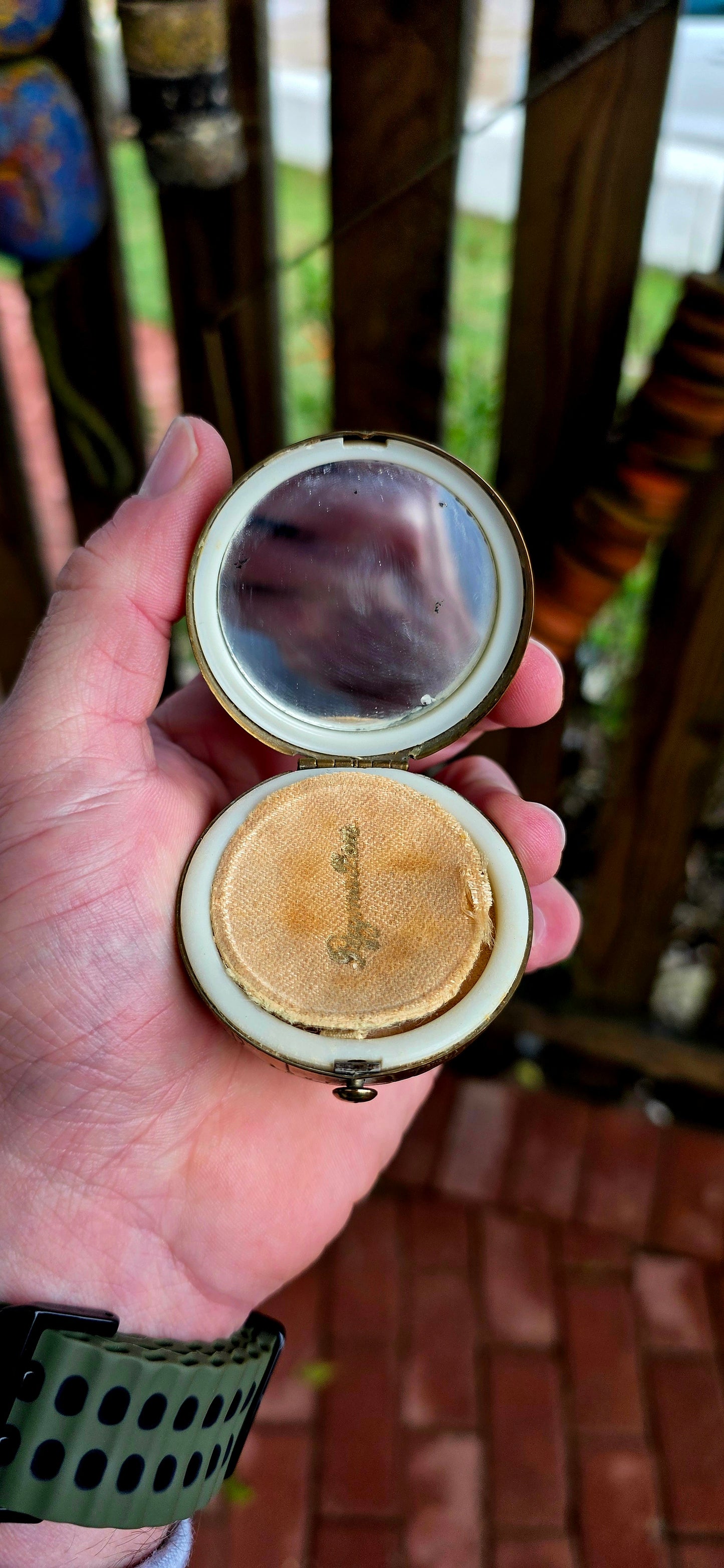 A wildly charming and highly sought-after mid-century novelty compact, beautifully crafted in warm golden brass — and shaped as a miniature world globe.