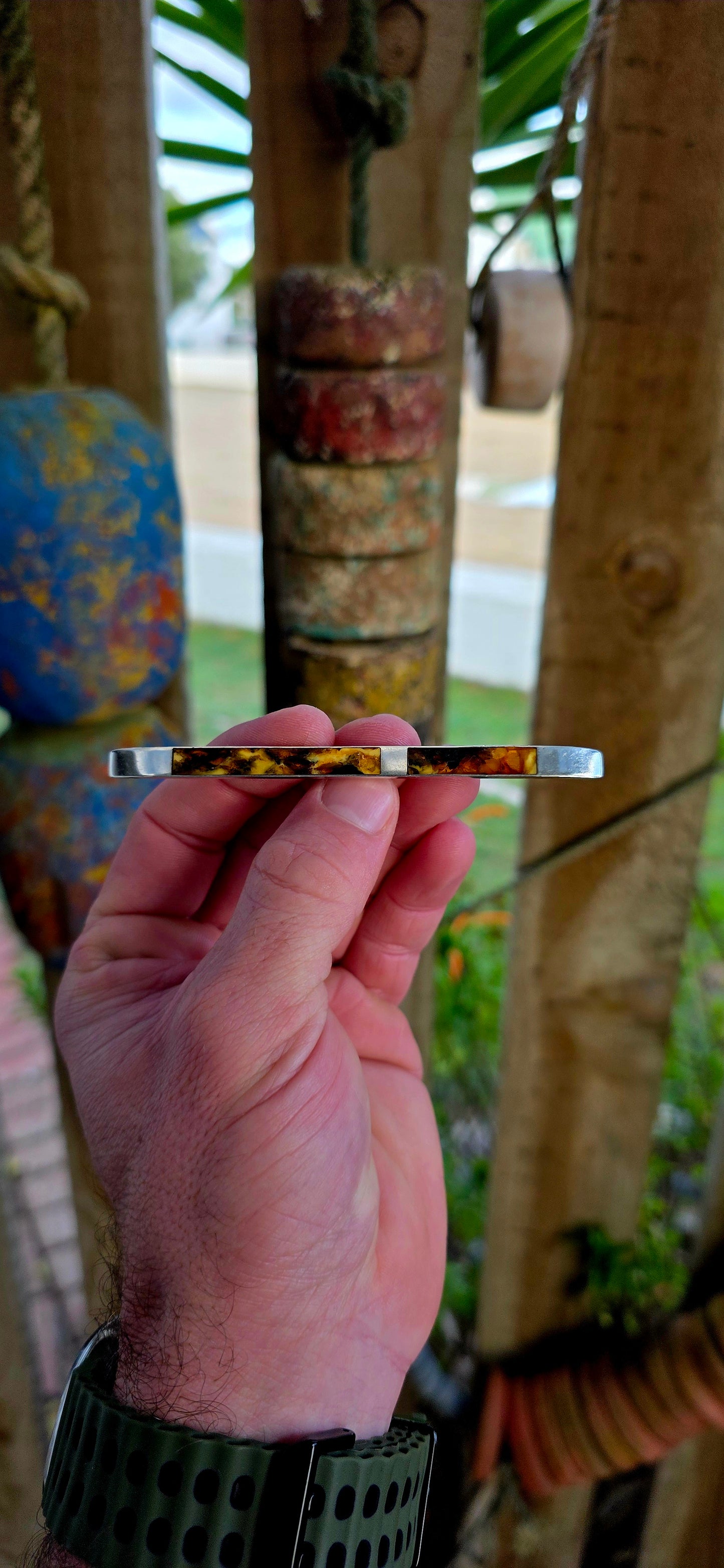 This circa 1940’s modernist brooch is all about clean lines and bold material contrast — a sleek, elongated sterling silver bar inlaid with warm, glowing panels of genuine Baltic amber.