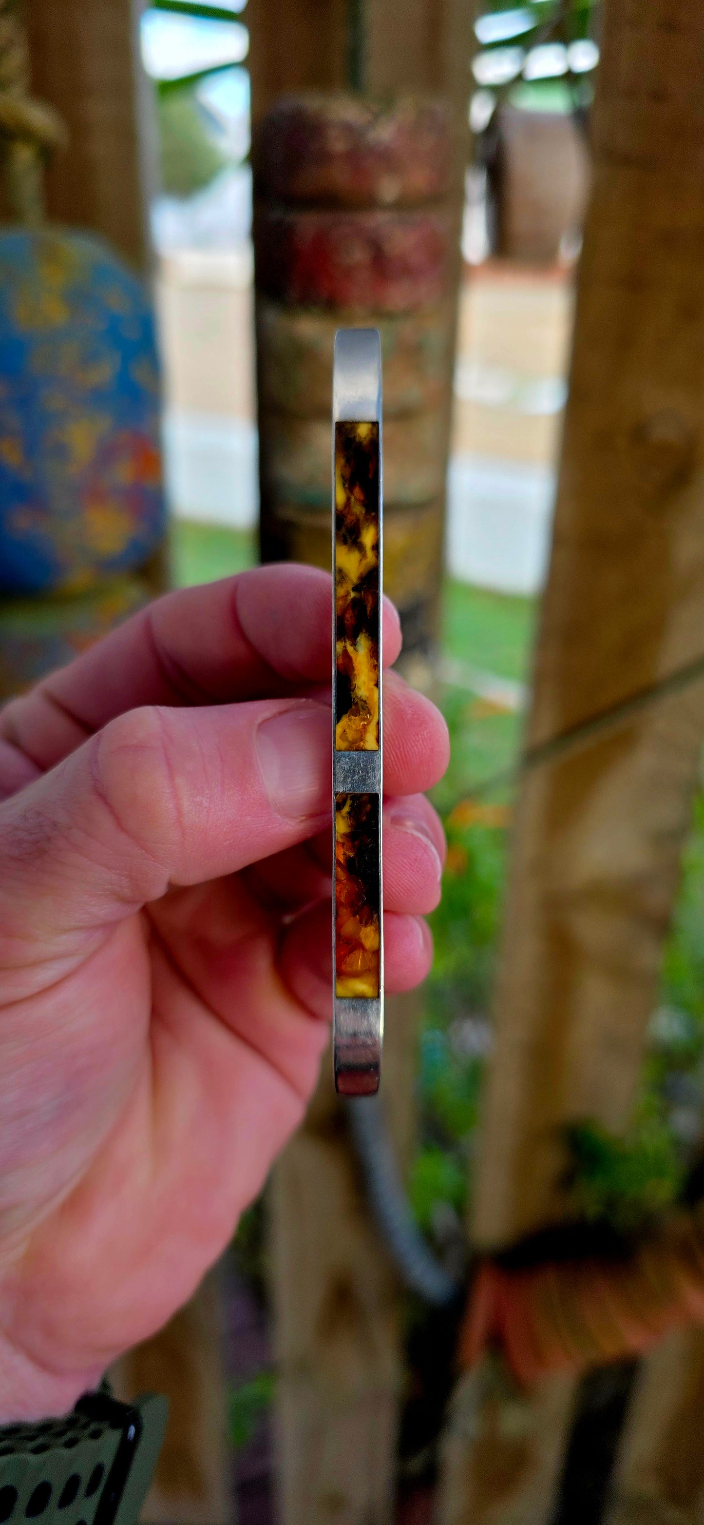 This circa 1940’s modernist brooch is all about clean lines and bold material contrast — a sleek, elongated sterling silver bar inlaid with warm, glowing panels of genuine Baltic amber.
