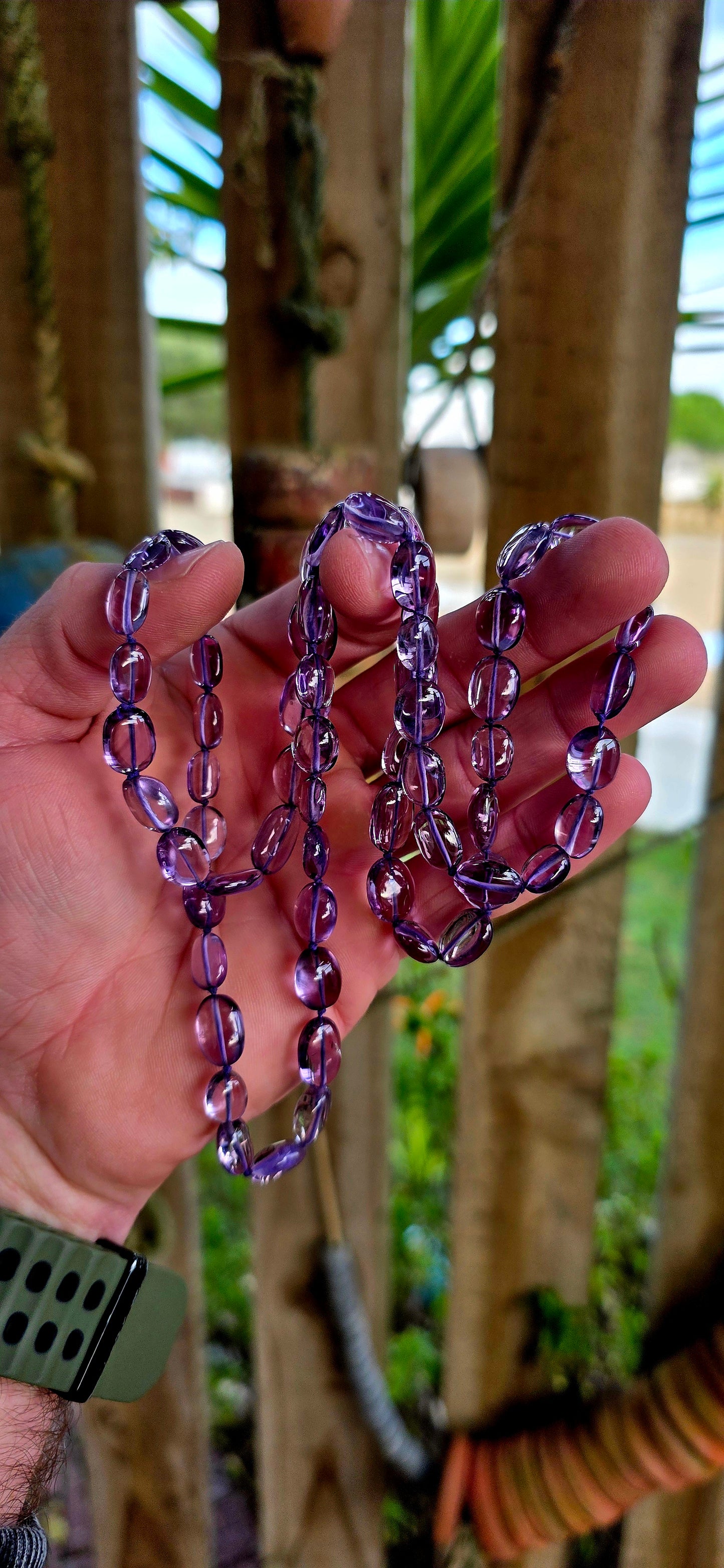 A striking extra-long strand of natural amethyst gemstone beads, glowing in those irresistible lavender-to-violet hues that shift beautifully in the light.