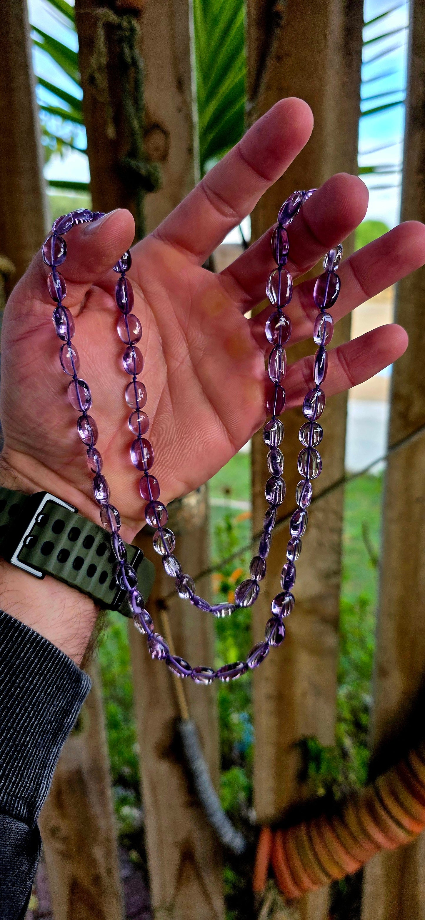 A striking extra-long strand of natural amethyst gemstone beads, glowing in those irresistible lavender-to-violet hues that shift beautifully in the light.