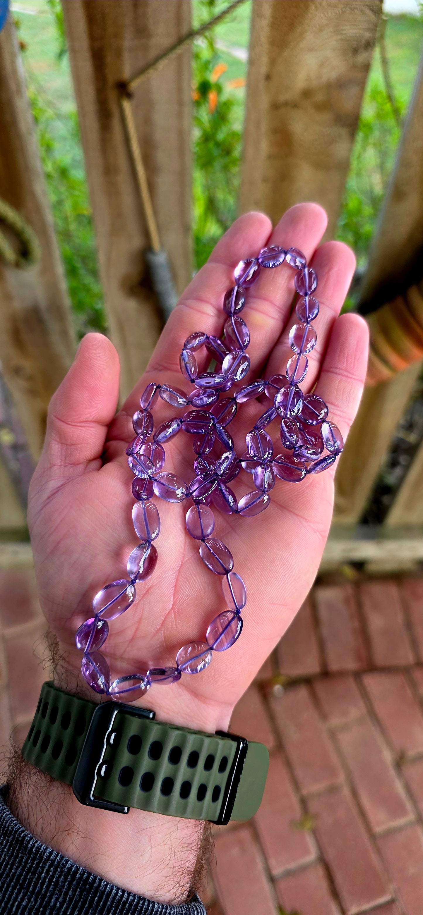 A striking extra-long strand of natural amethyst gemstone beads, glowing in those irresistible lavender-to-violet hues that shift beautifully in the light.