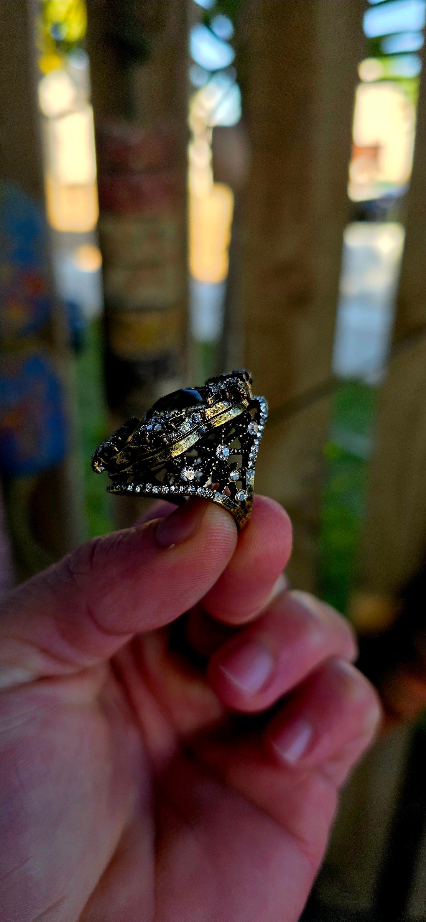 Marvelous oversized Victorian Revival costume dress ring crafted in richly antiqued brass, overflowing with old-world gothic glamour and theatrical sparkle.