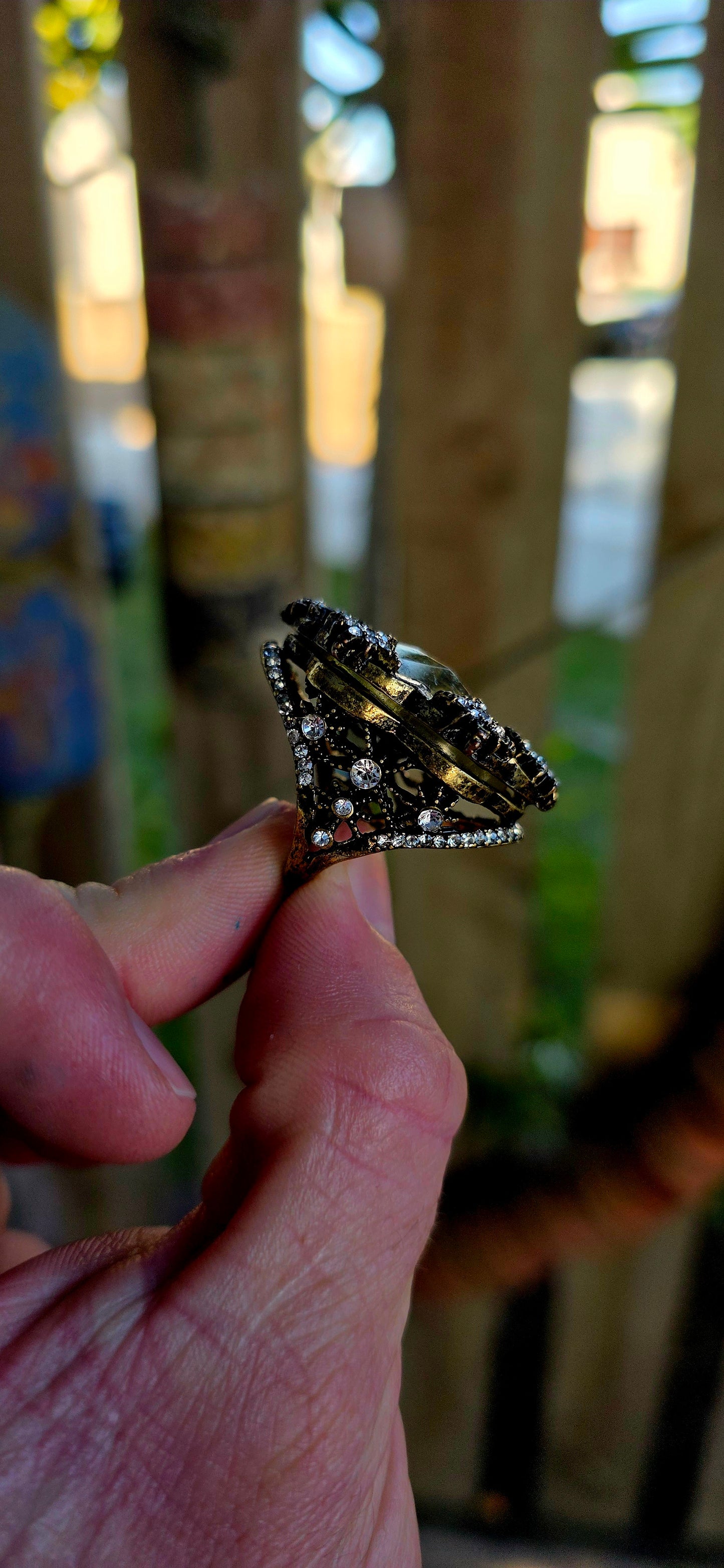 Marvelous oversized Victorian Revival costume dress ring crafted in richly antiqued brass, overflowing with old-world gothic glamour and theatrical sparkle.