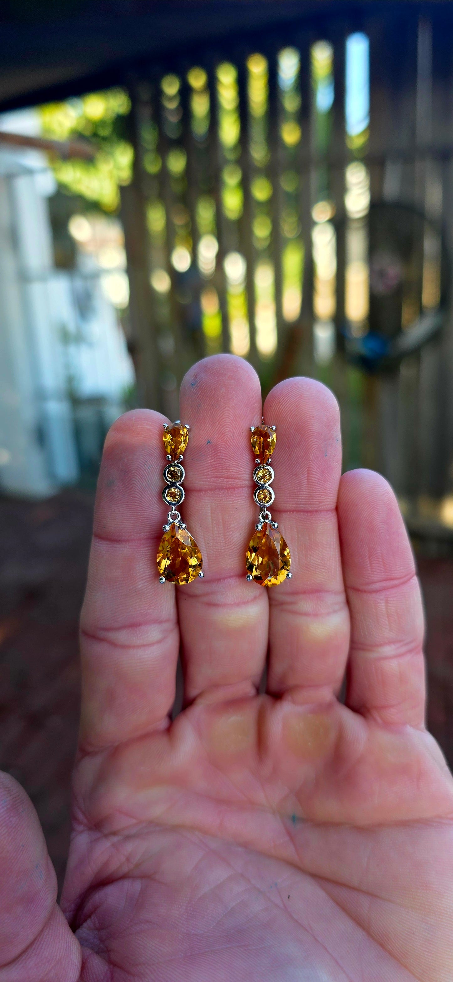 Absolutely radiant pair of sterling silver citrine drop earrings, glowing in the richest honey-golden tones.