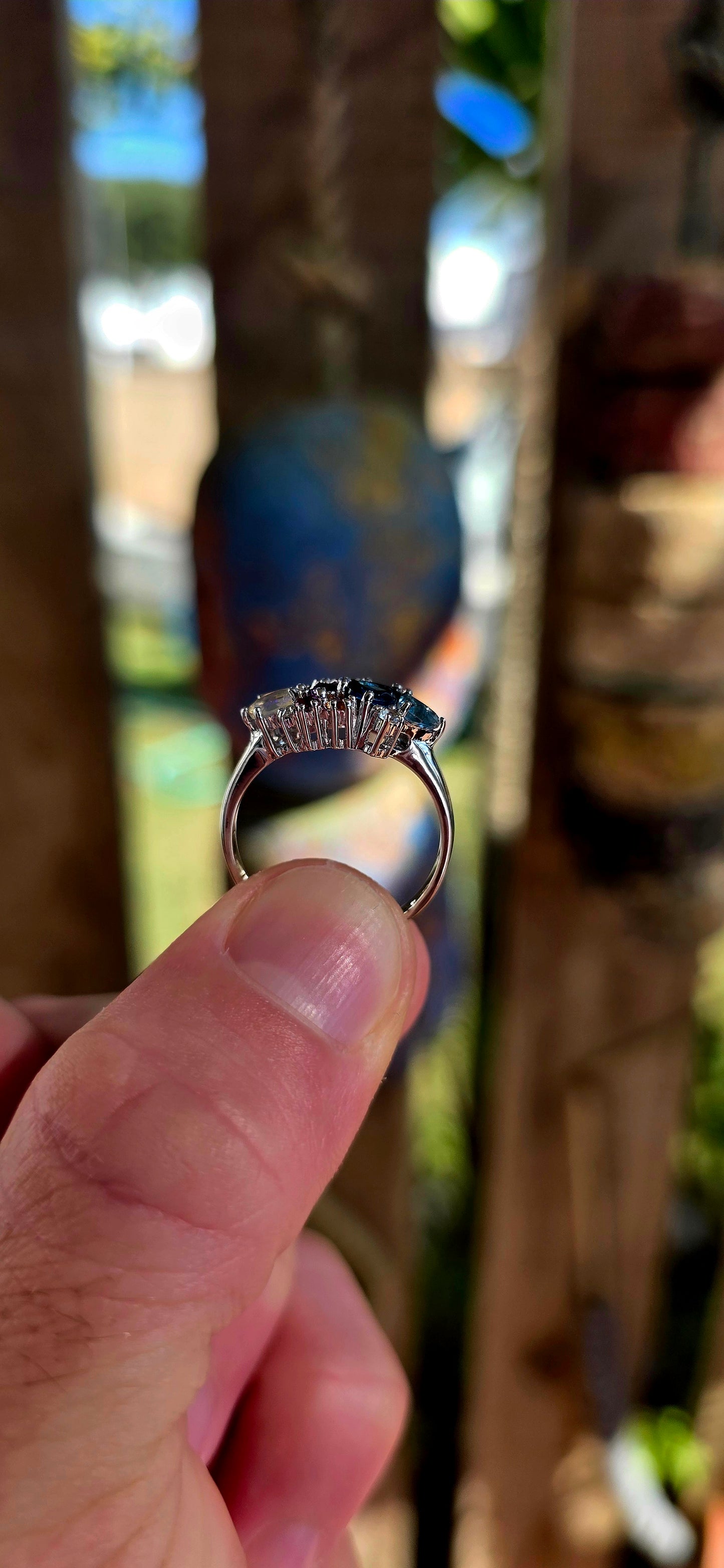 An enchanting sterling silver cluster ring finished in luminous rhodium plating, this marvelous piece feels like a tiny treasure chest of gemstones gathered from across the cosmos.