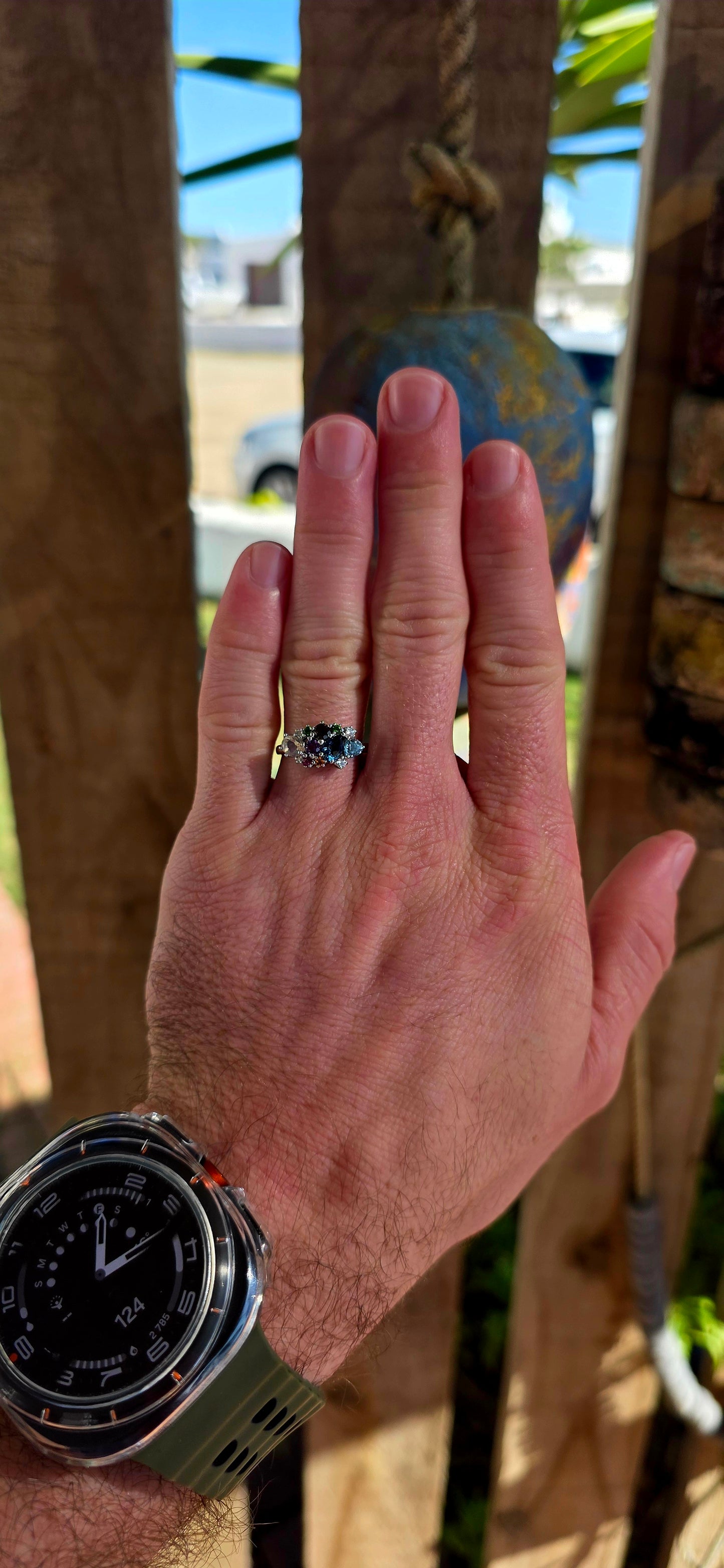 An enchanting sterling silver cluster ring finished in luminous rhodium plating, this marvelous piece feels like a tiny treasure chest of gemstones gathered from across the cosmos.