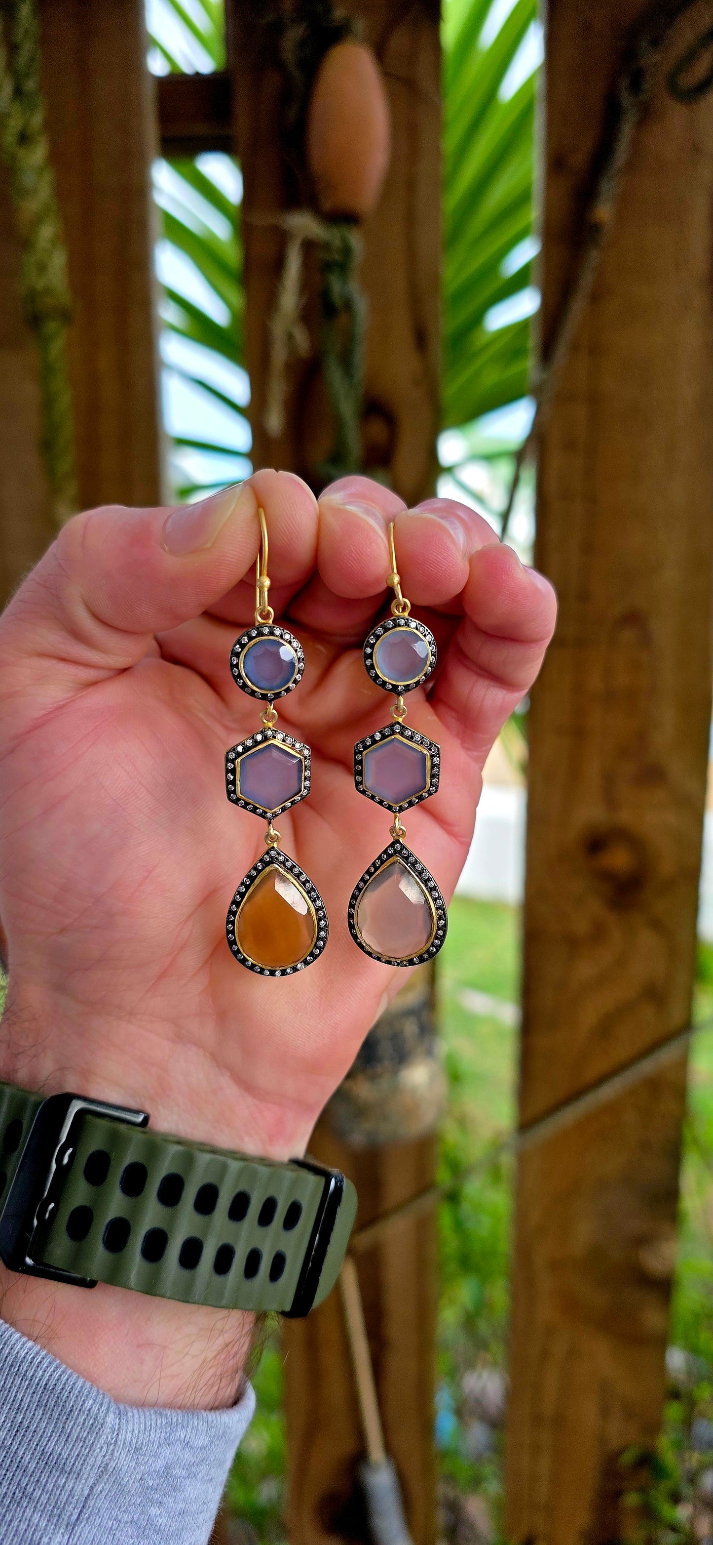Magical pair of sterling silver drop earrings with rich satin yellow gold plating, featuring beautifully faceted chalcedony gemstones in round, hexagon and pear-shaped cuts.