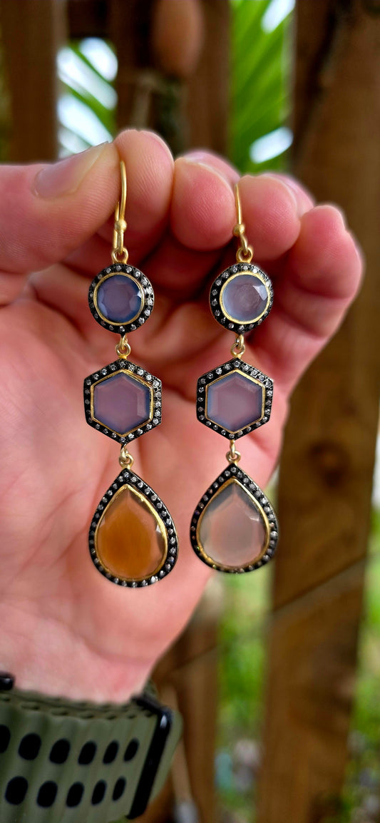 Magical pair of sterling silver drop earrings with rich satin yellow gold plating, featuring beautifully faceted chalcedony gemstones in round, hexagon and pear-shaped cuts.