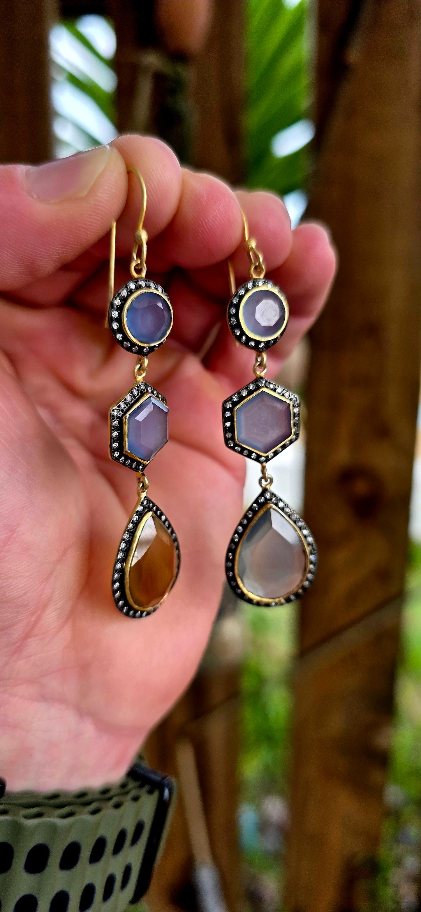 Magical pair of sterling silver drop earrings with rich satin yellow gold plating, featuring beautifully faceted chalcedony gemstones in round, hexagon and pear-shaped cuts.