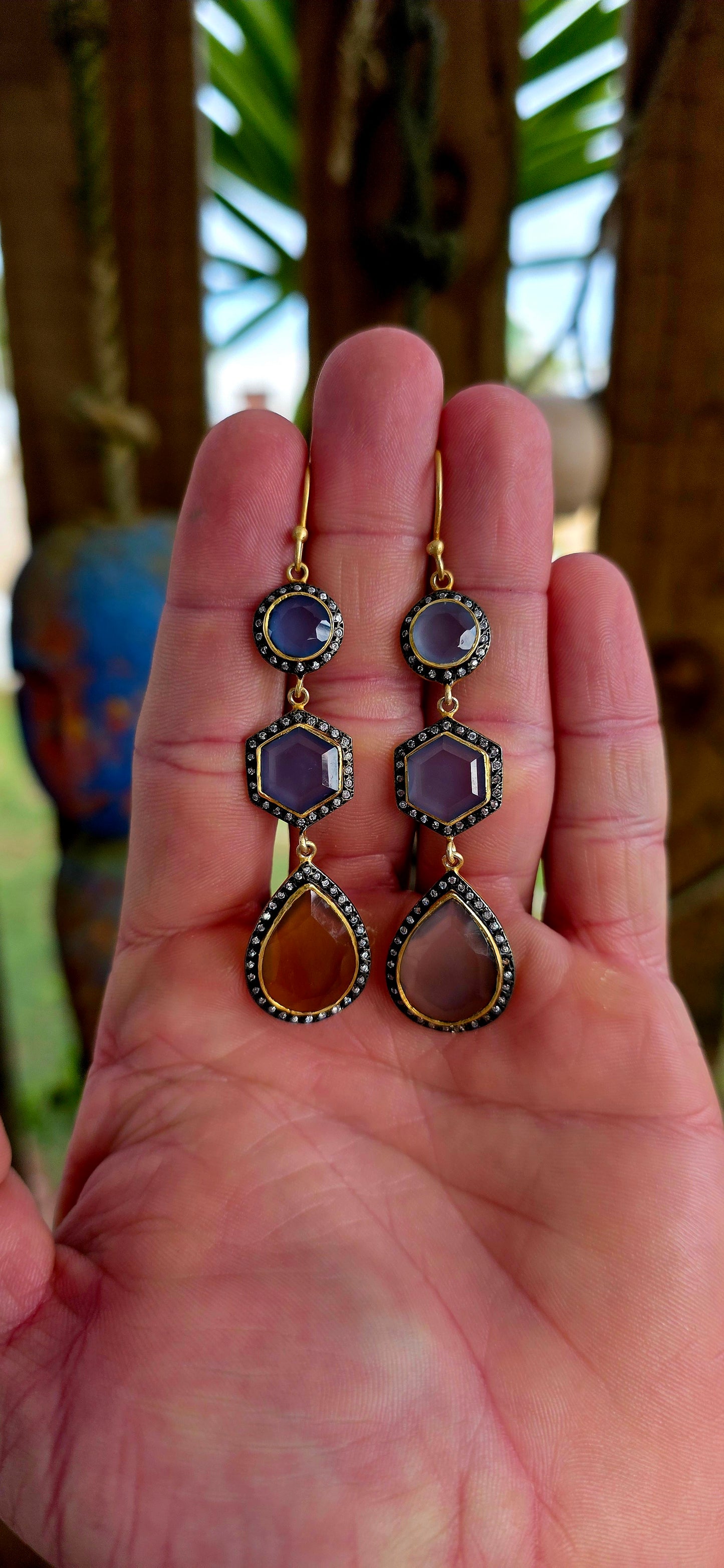 Magical pair of sterling silver drop earrings with rich satin yellow gold plating, featuring beautifully faceted chalcedony gemstones in round, hexagon and pear-shaped cuts.