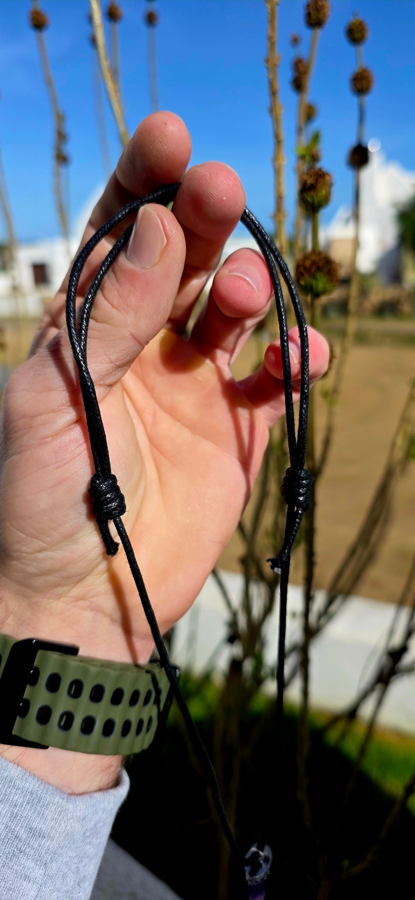 Earthy, mystical and wonderfully organic — this artisan-made unisex talisman necklace features a polished freeform amethyst shard in a beautifully tapered claw/tooth-inspired shape.