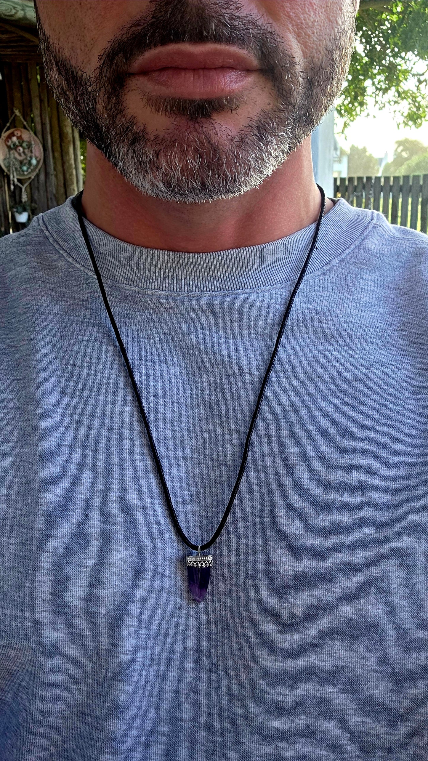Earthy, mystical and wonderfully organic — this artisan-made unisex talisman necklace features a polished freeform amethyst shard in a beautifully tapered claw/tooth-inspired shape.