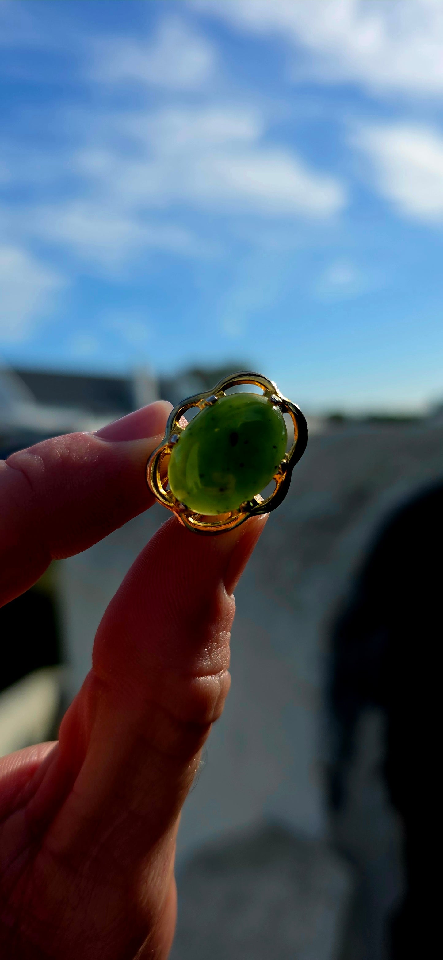 Beautiful pair of vintage designer clip-on earrings crafted in rich yellow gold-filled metal and prong set with glowing oval-shaped Nephrite Jade cabochons in the highly sought-after “Spinach Jade” variety.