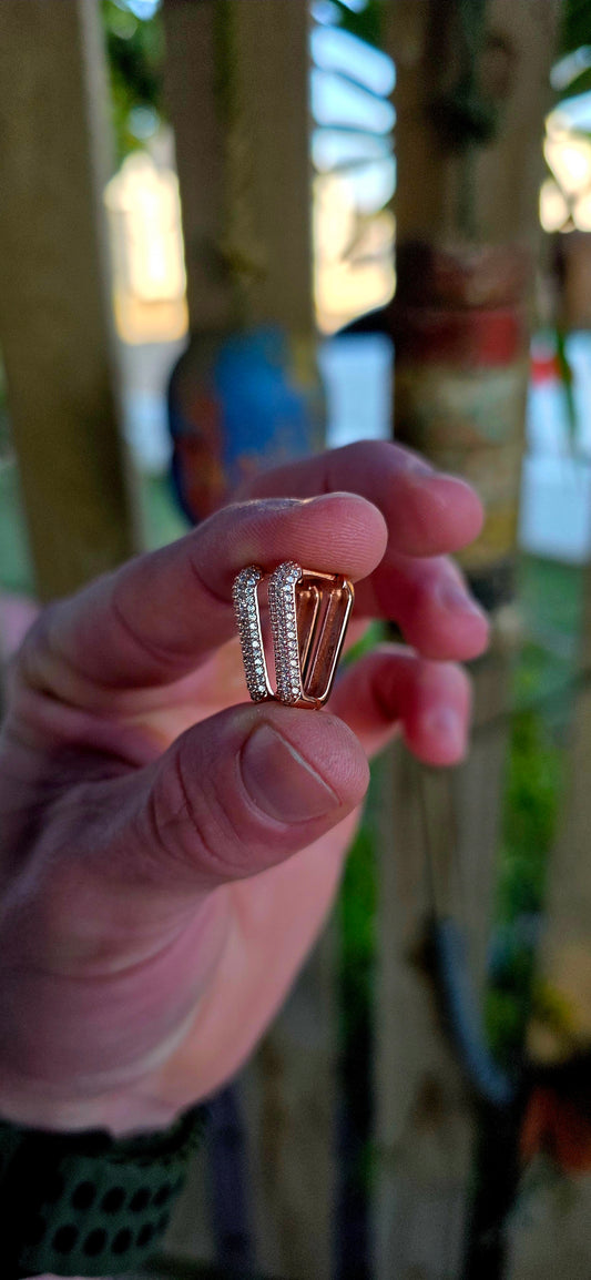 Elegant, sleek, and endlessly wearable… these sterling silver huggie earrings with warm rose gold plating are giving effortless luxury energy.