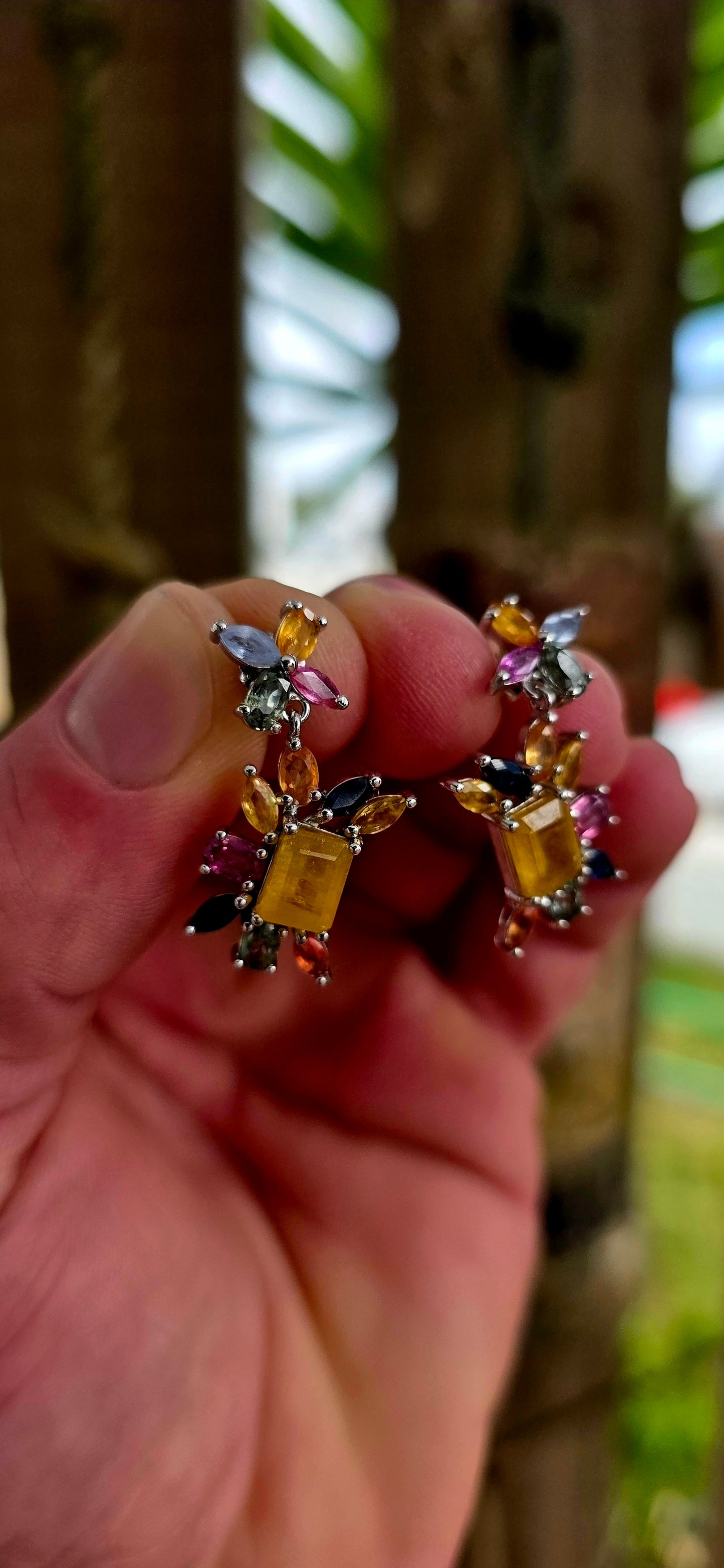 Absolutely enchanting and bursting with joyful colour .These sterling silver floral-inspired drop earrings are a true celebration of vibrant gemstones and playful elegance.