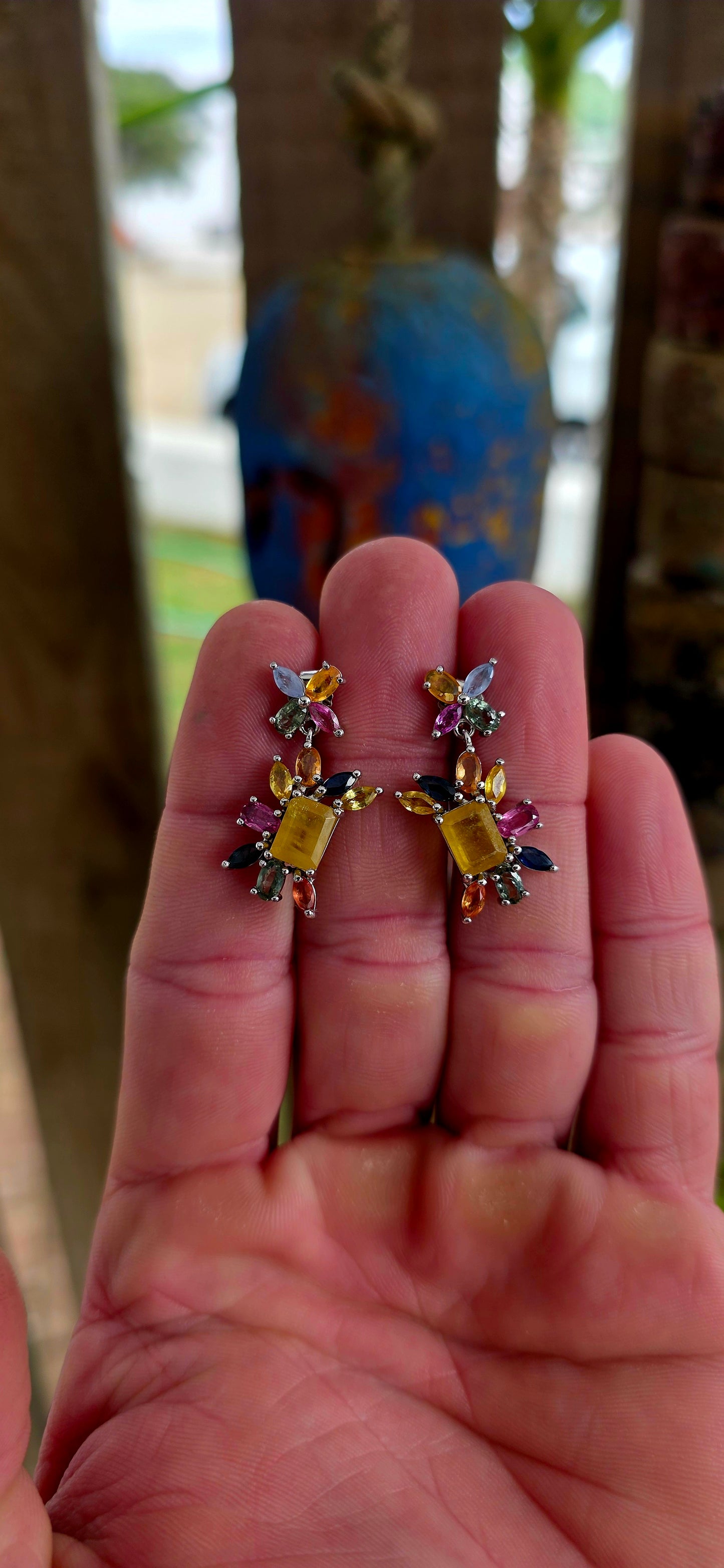Absolutely enchanting and bursting with joyful colour .These sterling silver floral-inspired drop earrings are a true celebration of vibrant gemstones and playful elegance.