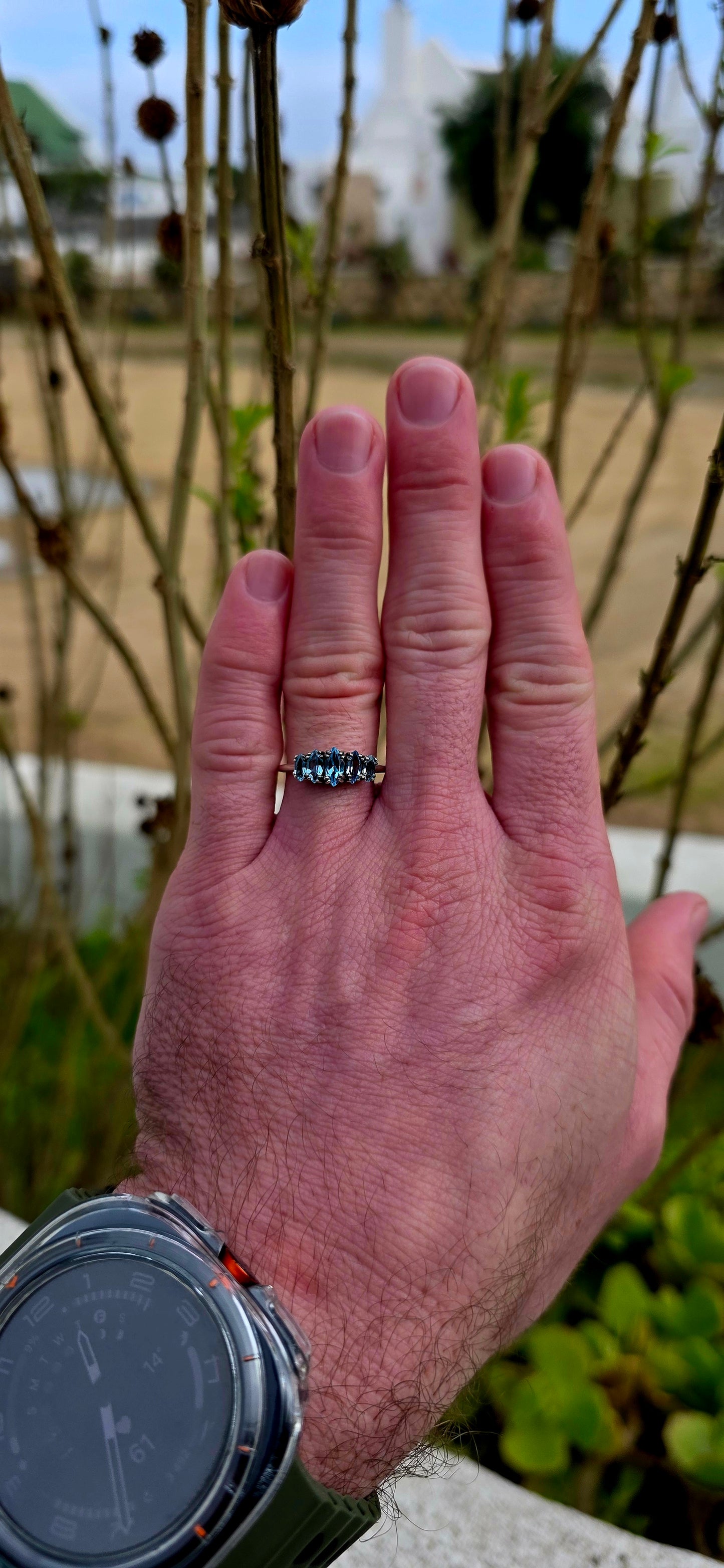 Delicate, dreamy, and filled with icy sparkle… this enchanting sterling silver ring is adorned with five marquise-cut sky blue topaz gemstones arranged in a graceful crown-like formation.