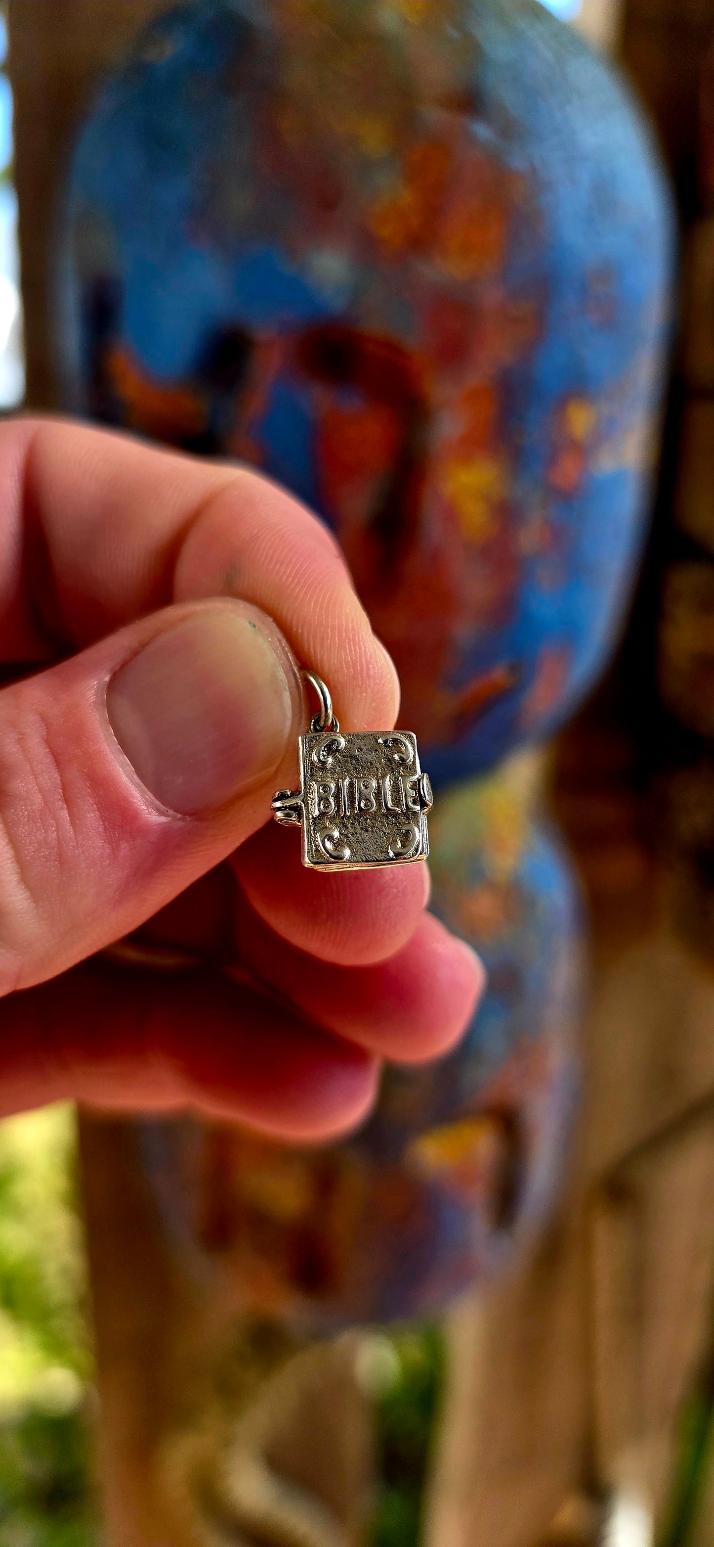 Up for grabs is the sweetest vintage sterling silver articulated charm in the shape of a miniature Bible.