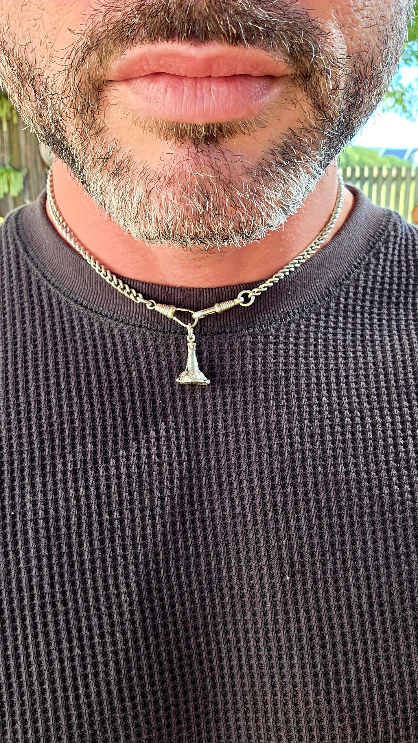 Up for grabs is the most magical vintage sterling silver articulated charm in the shape of a tiny lighthouse .