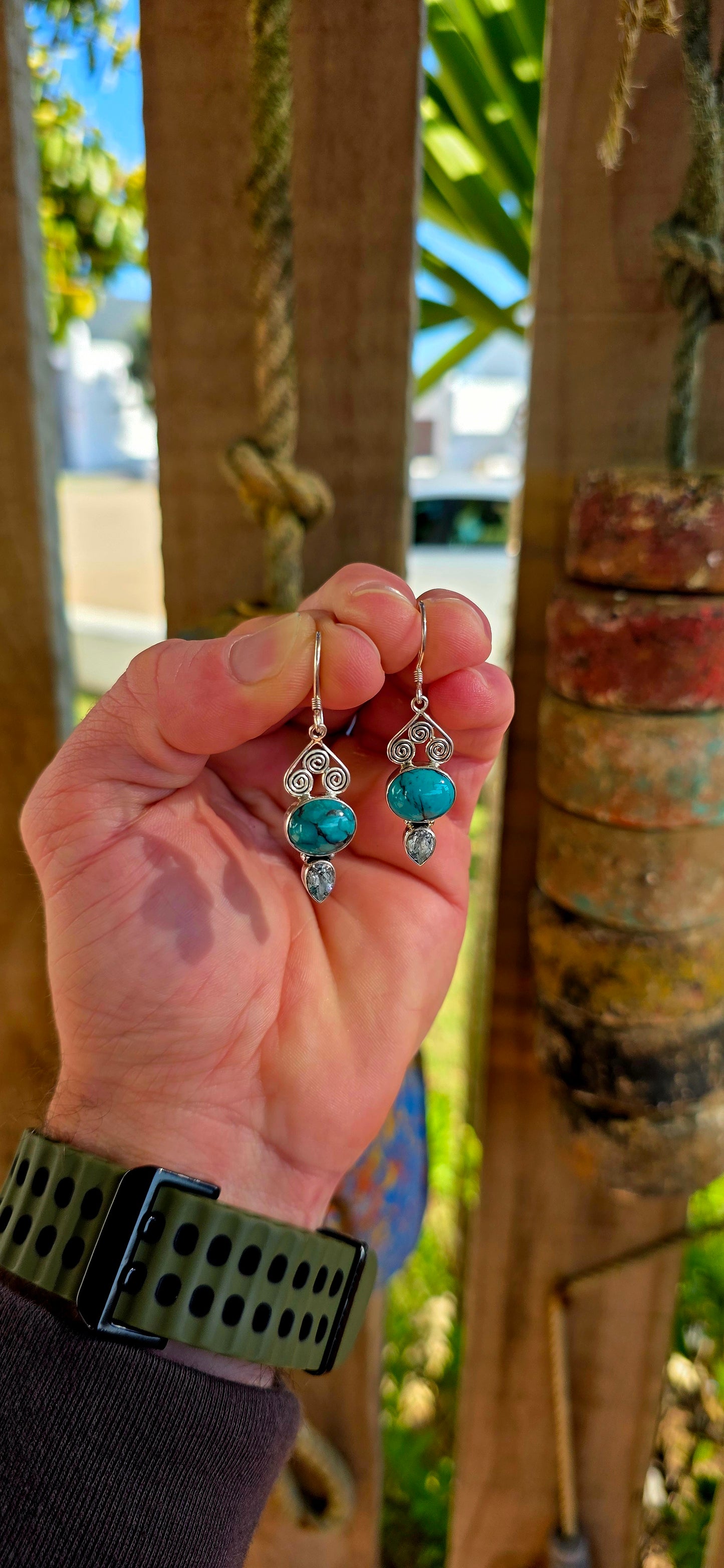 Crafted in sterling silver, the earrings feature beautiful tube-set oval turquoise cabochons displaying those dreamy natural black matrix patterns that make every turquoise stone completely unique .