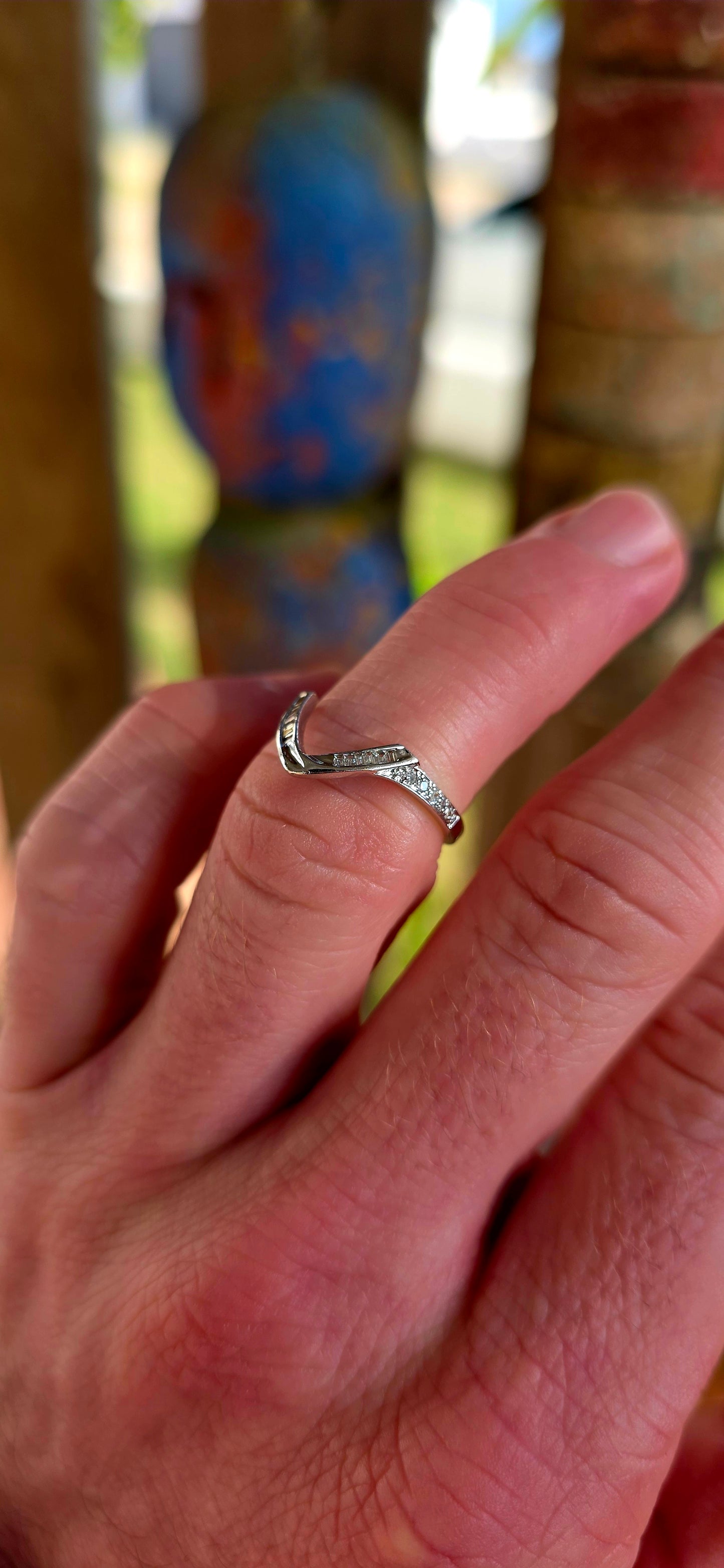 A beautifully contemporary piece that plays with form, light, and clean design — perfect for stacking, styling, or wearing solo.