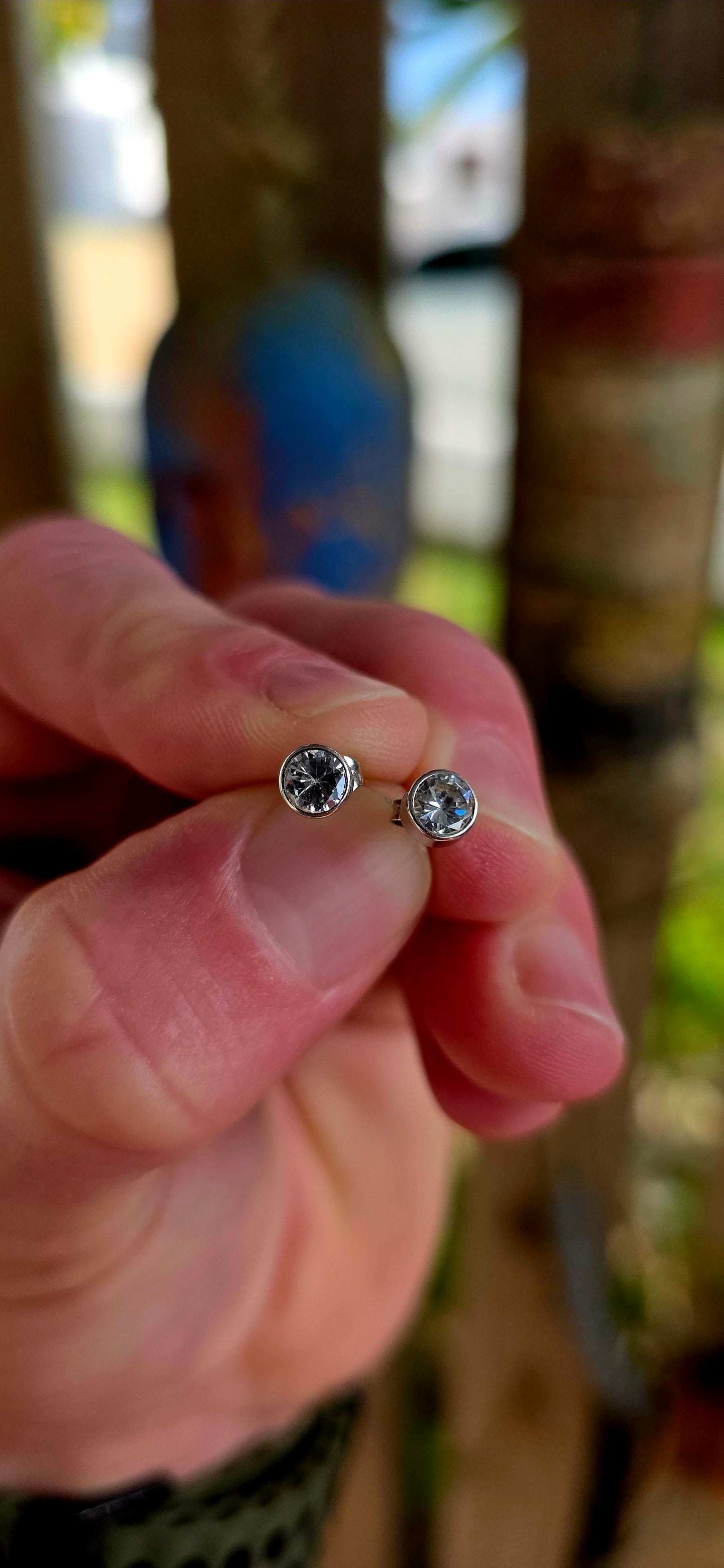 A beautifully classic pair of 9ct white gold solitaire stud earrings — elegant, and endlessly wearable.
