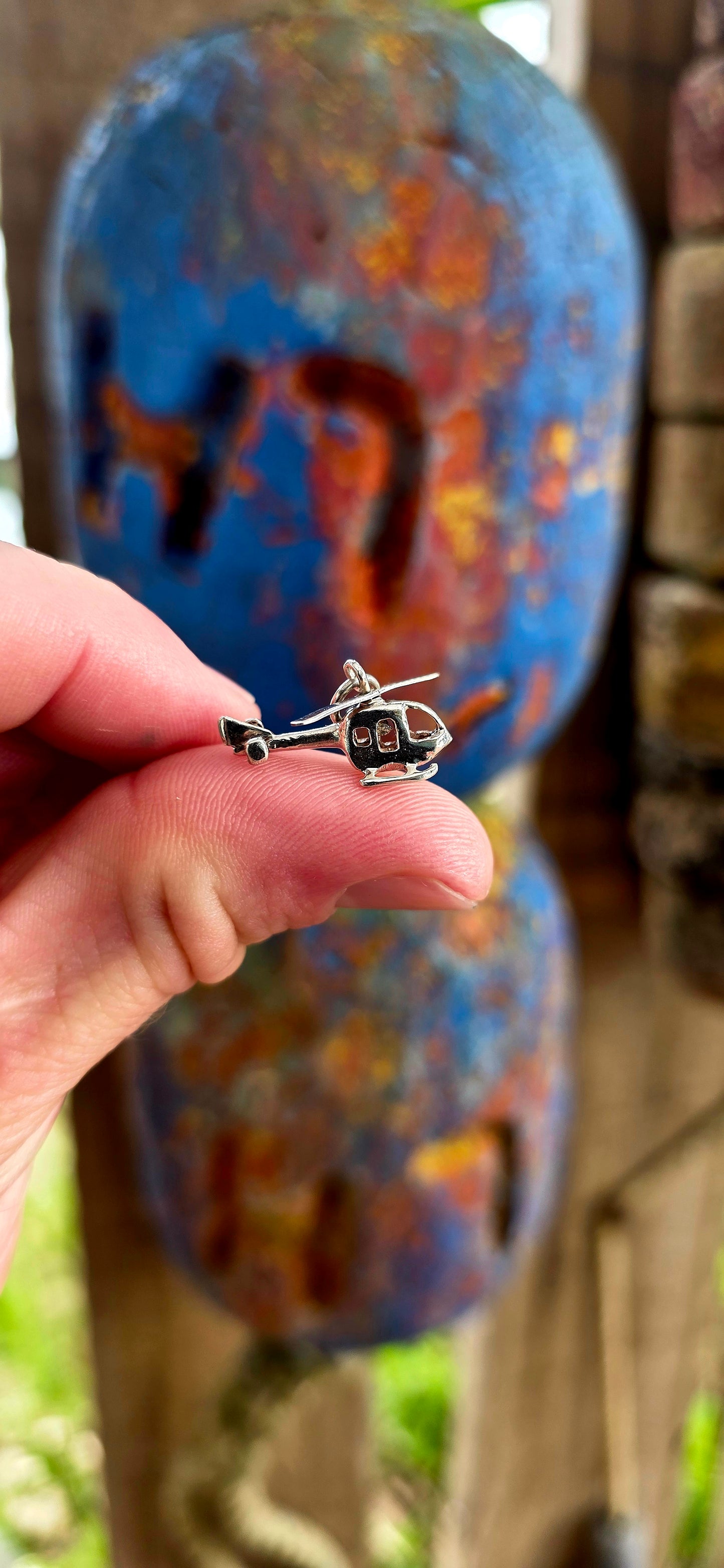 Delightful vintage sterling silver articulated charm in the shape of a tiny helicopter.