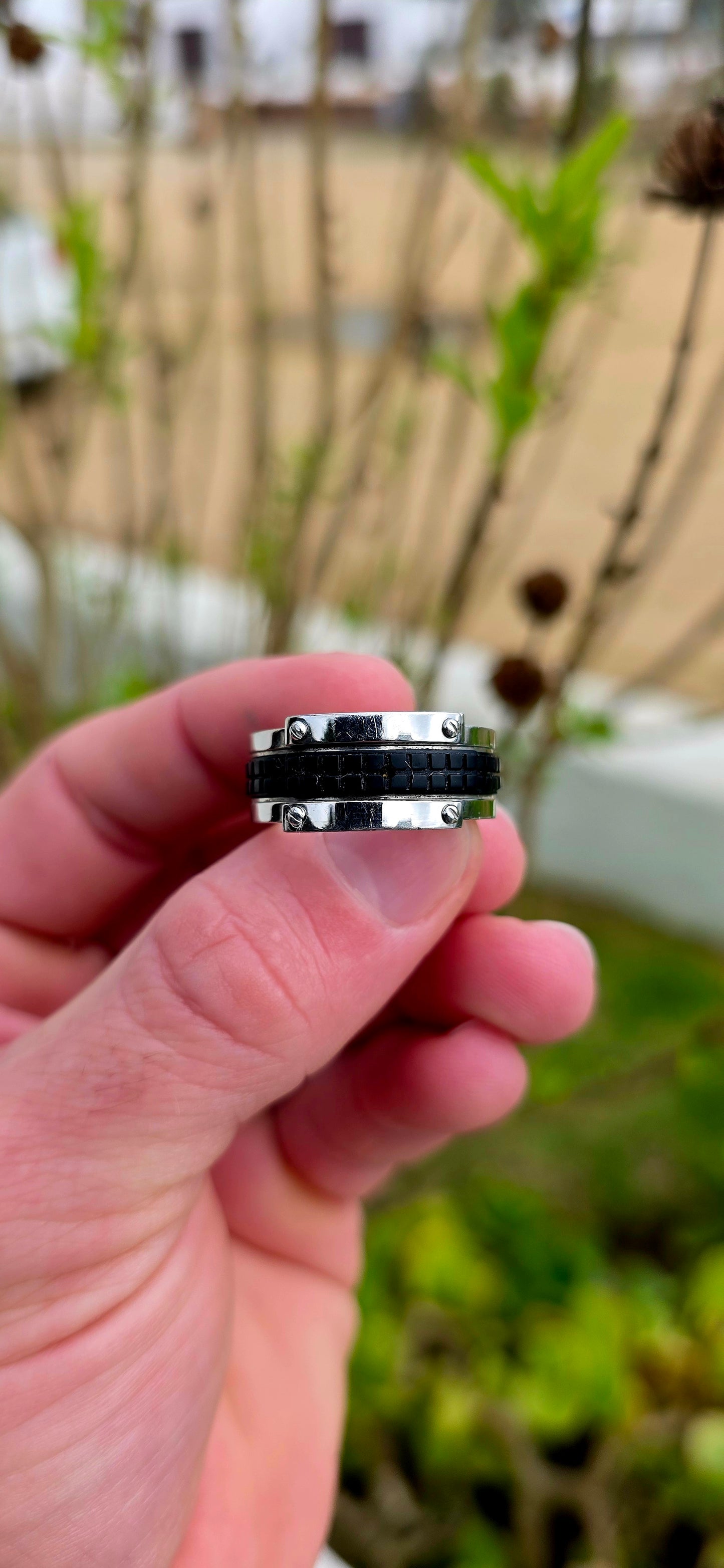 Bold, masculine, and contemporary... this chunky designer ring by Emporio Armani perfectly captures the sleek industrial aesthetic that has become synonymous with the brand's modern menswear collections.