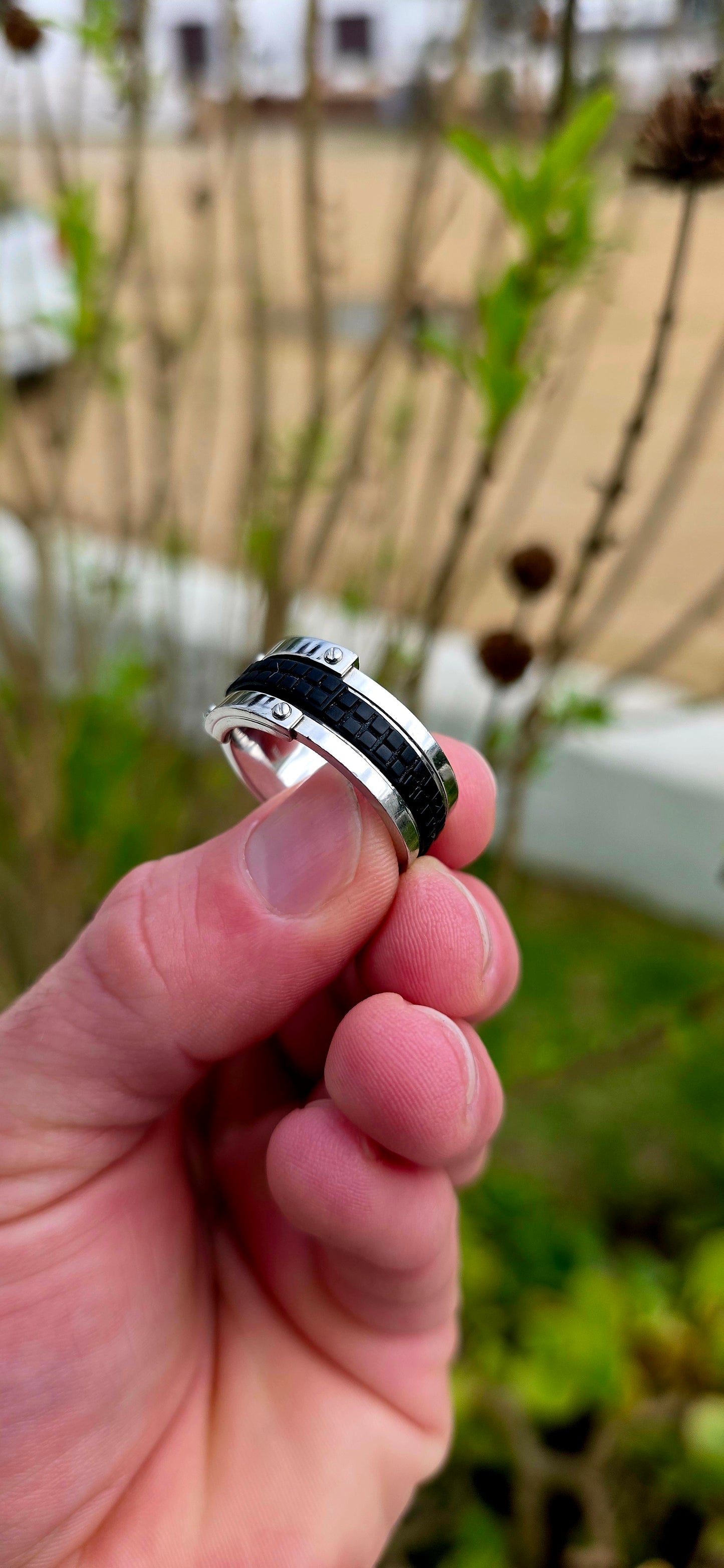 Bold, masculine, and contemporary... this chunky designer ring by Emporio Armani perfectly captures the sleek industrial aesthetic that has become synonymous with the brand's modern menswear collections.