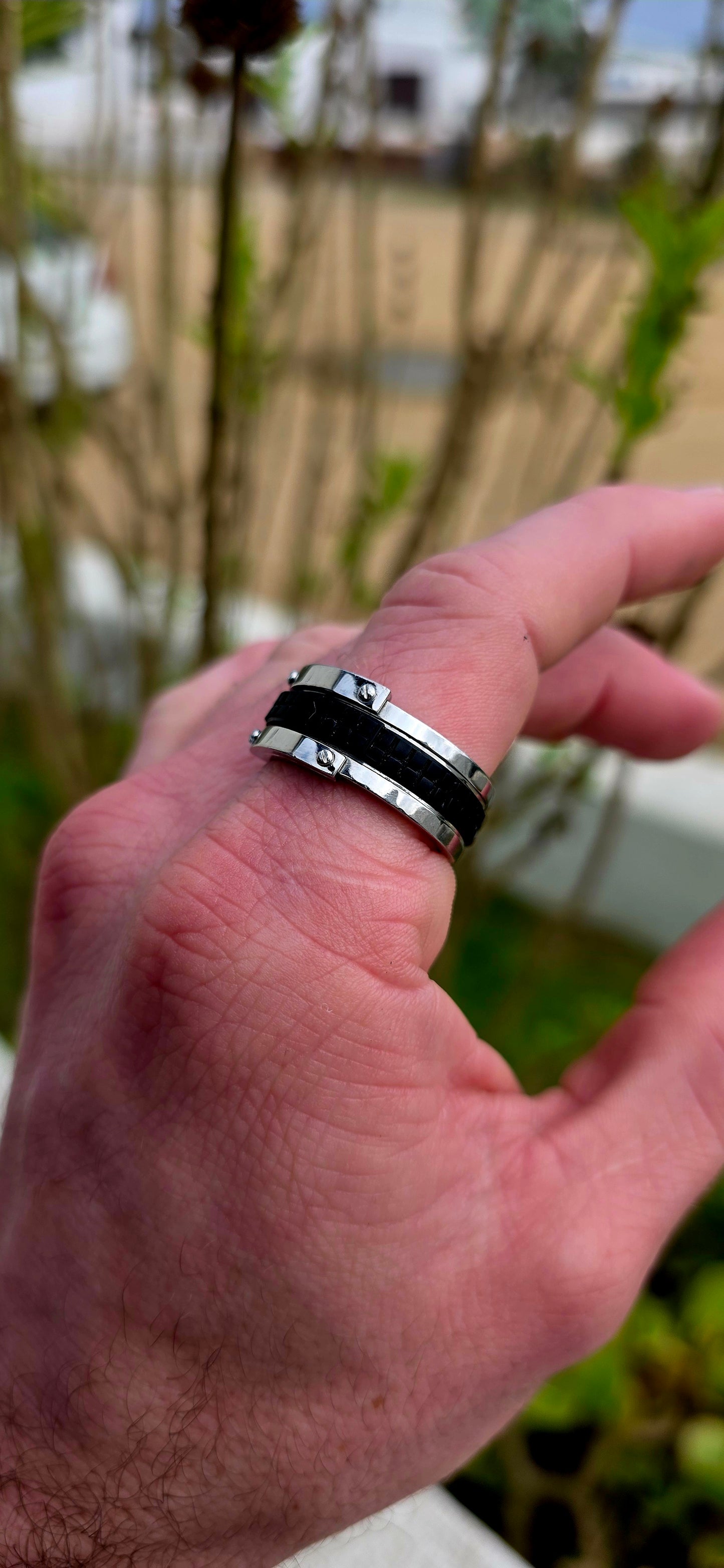 Bold, masculine, and contemporary... this chunky designer ring by Emporio Armani perfectly captures the sleek industrial aesthetic that has become synonymous with the brand's modern menswear collections.