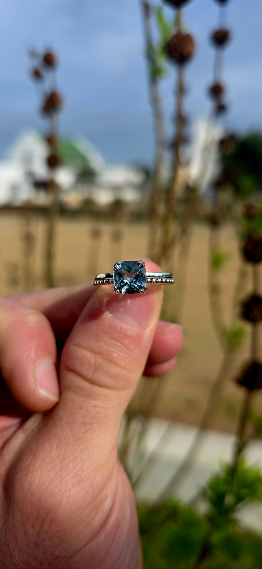Delicate, elegant and wonderfully unique... this sterling silver solitaire ring offers a fresh take on a timeless classic .