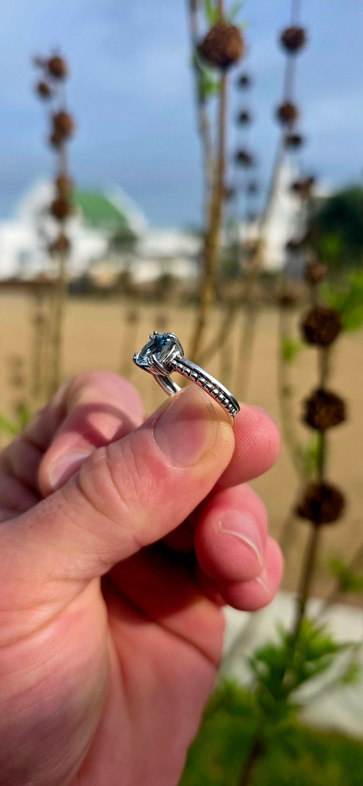 Delicate, elegant and wonderfully unique... this sterling silver solitaire ring offers a fresh take on a timeless classic .
