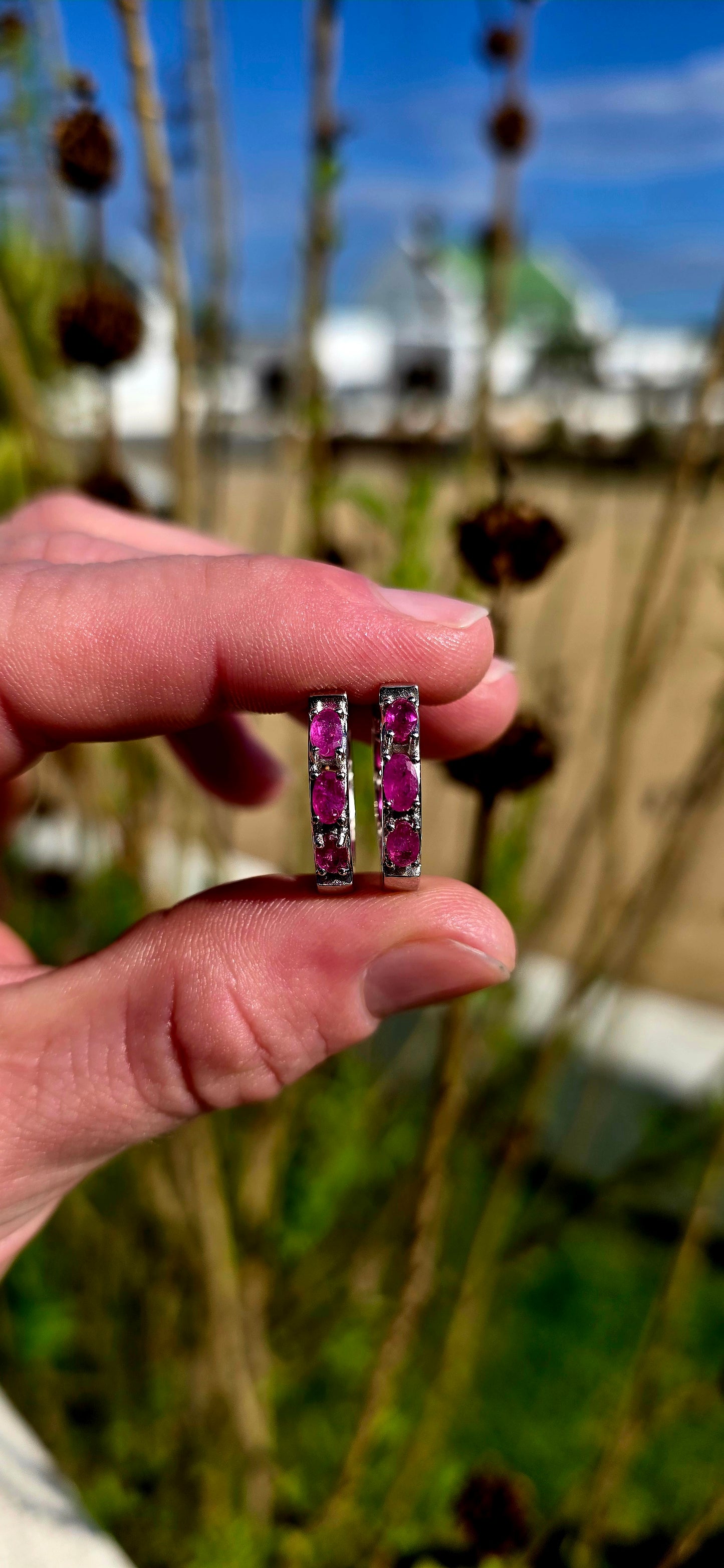 These sterling silver ruby huggie earrings are the perfect everyday luxury for lovers of vibrant gemstones .