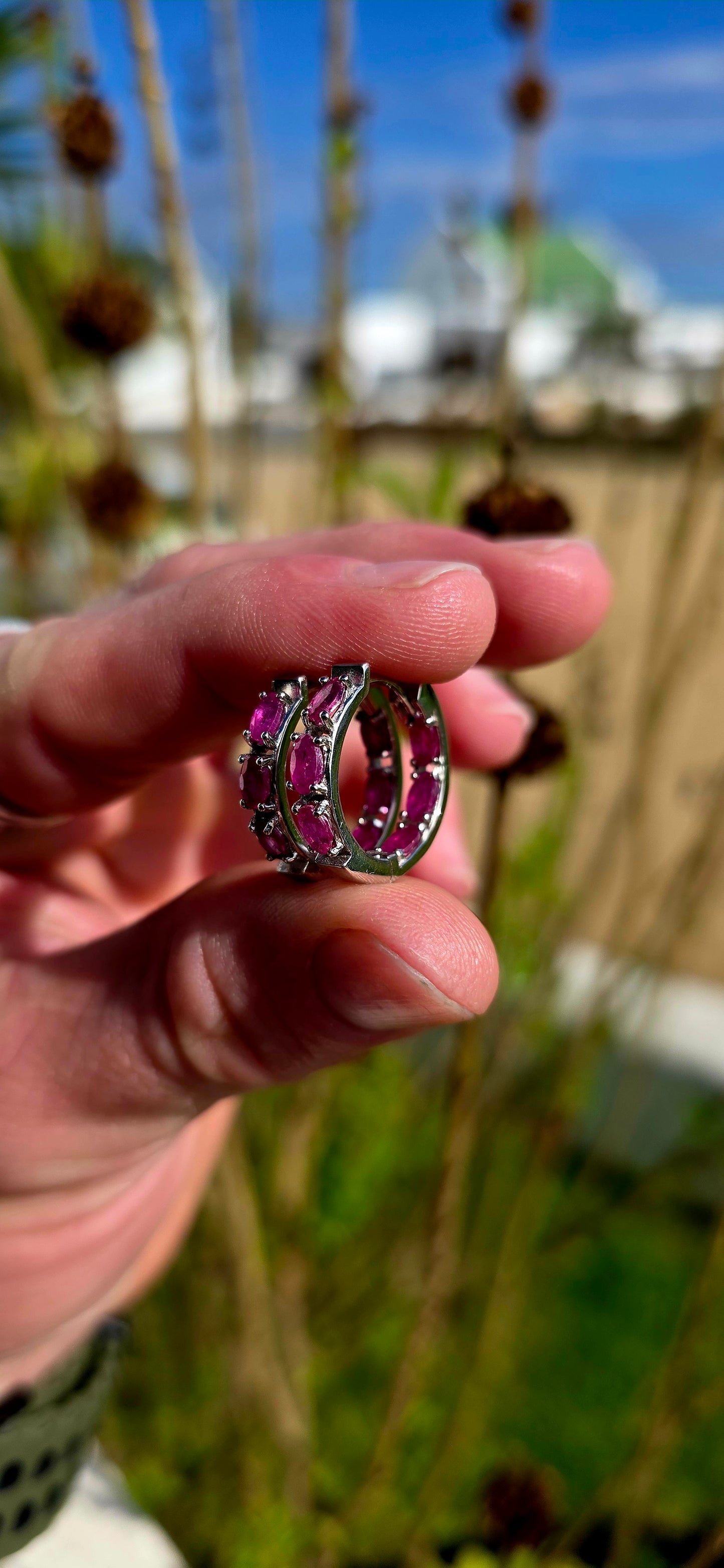 These sterling silver ruby huggie earrings are the perfect everyday luxury for lovers of vibrant gemstones .