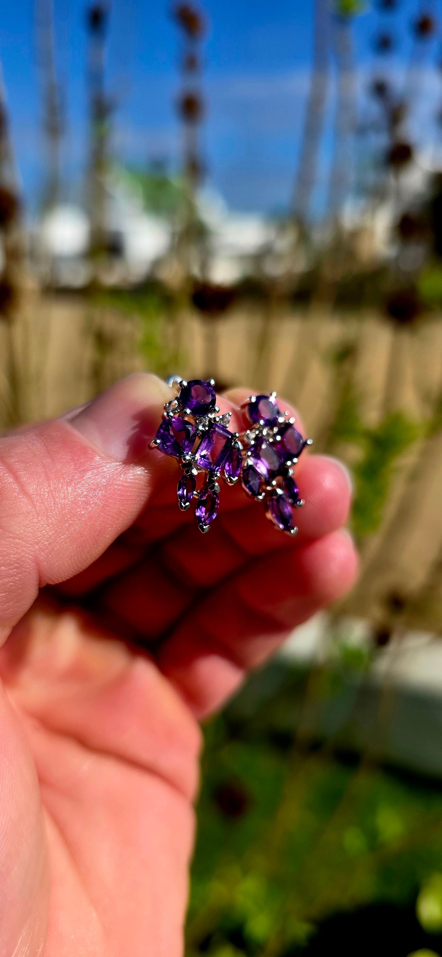 Bold, glamorous and bursting with royal colour...
Crafted in sterling silver, each earring is adorned with a dazzling arrangement of richly coloured amethyst gemstones in a beautiful variety of cuts.