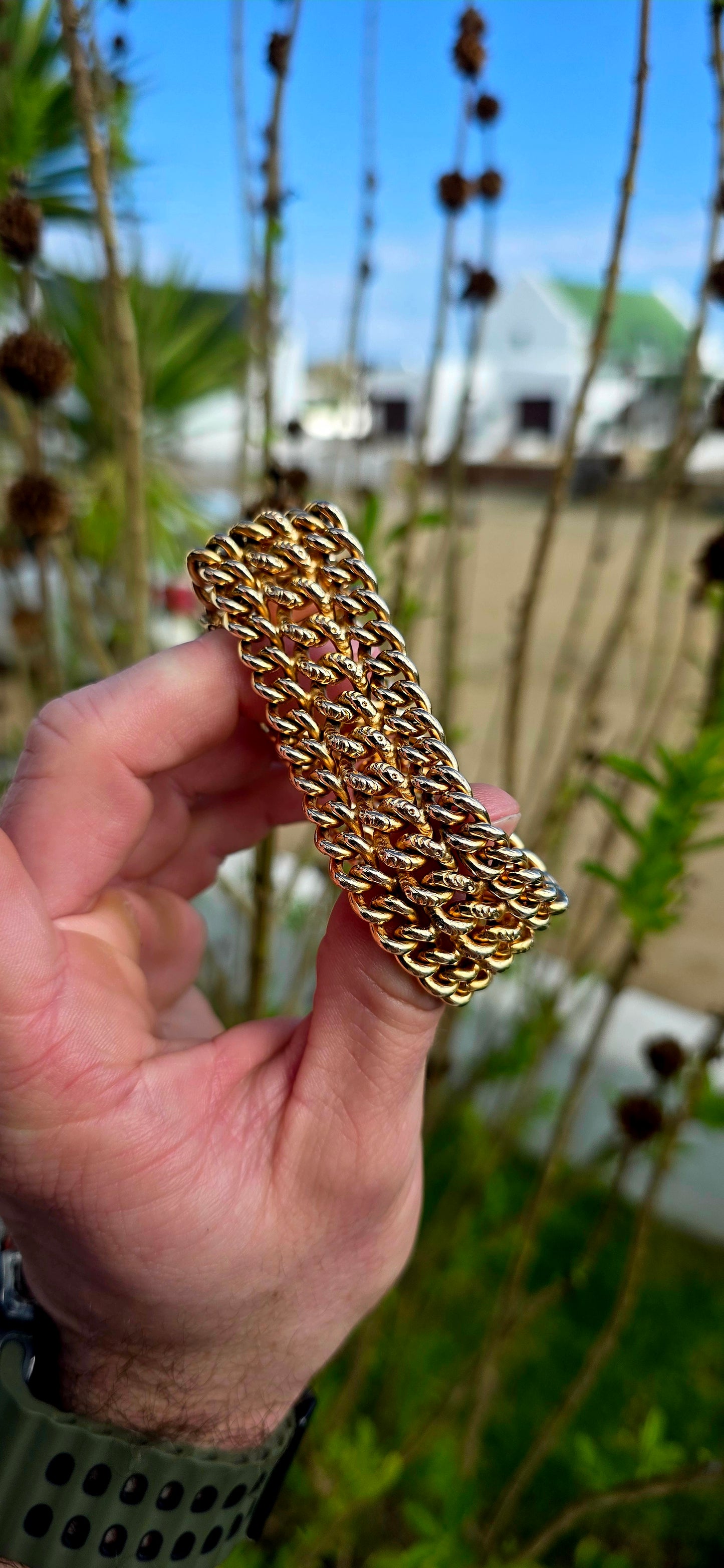 This absolutely magnificent vintage French bracelet is crafted in richly glowing yellow/rosy gold-filled metal and features an incredibly substantial three-row curb link design that drapes beautifully around the wrist.