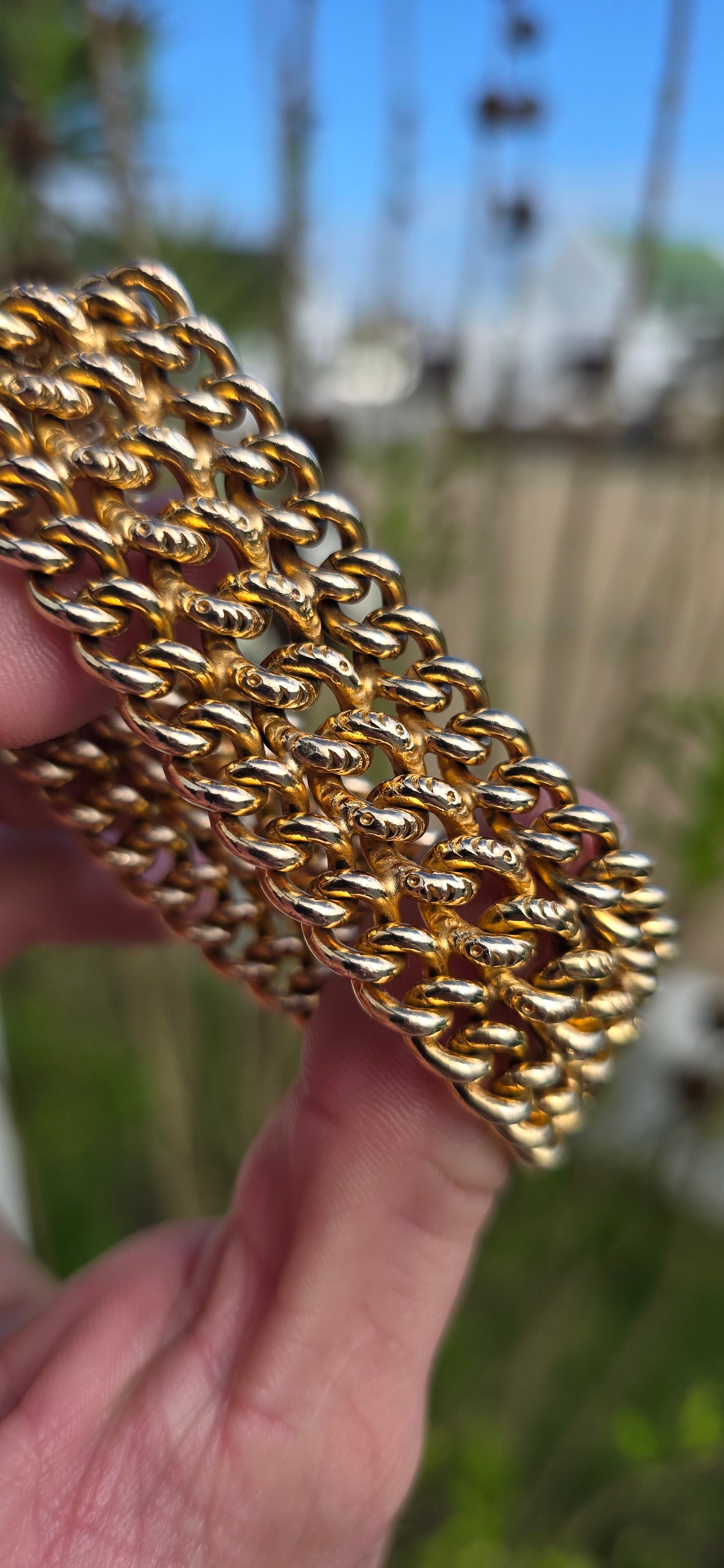 This absolutely magnificent vintage French bracelet is crafted in richly glowing yellow/rosy gold-filled metal and features an incredibly substantial three-row curb link design that drapes beautifully around the wrist.