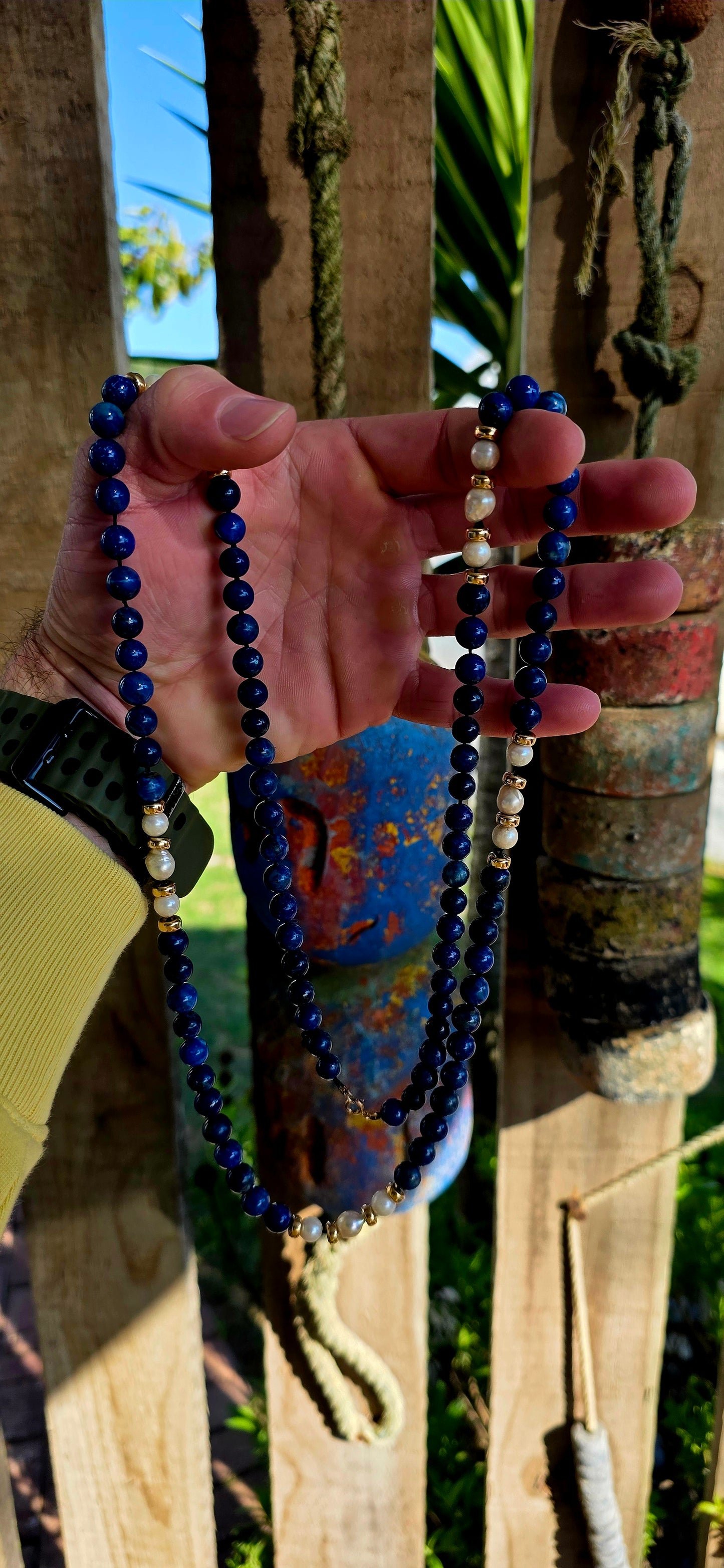 A striking statement piece that combines the rich blues of ancient royalty with the  elegance of pearls and gold.