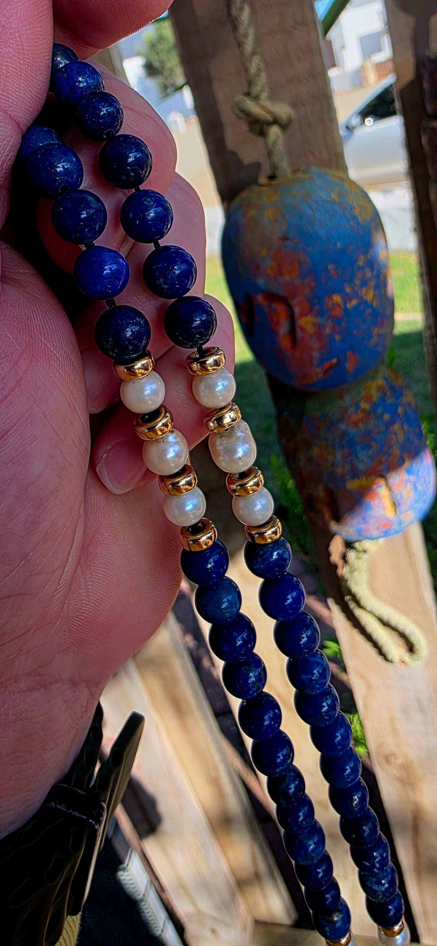 A striking statement piece that combines the rich blues of ancient royalty with the  elegance of pearls and gold.