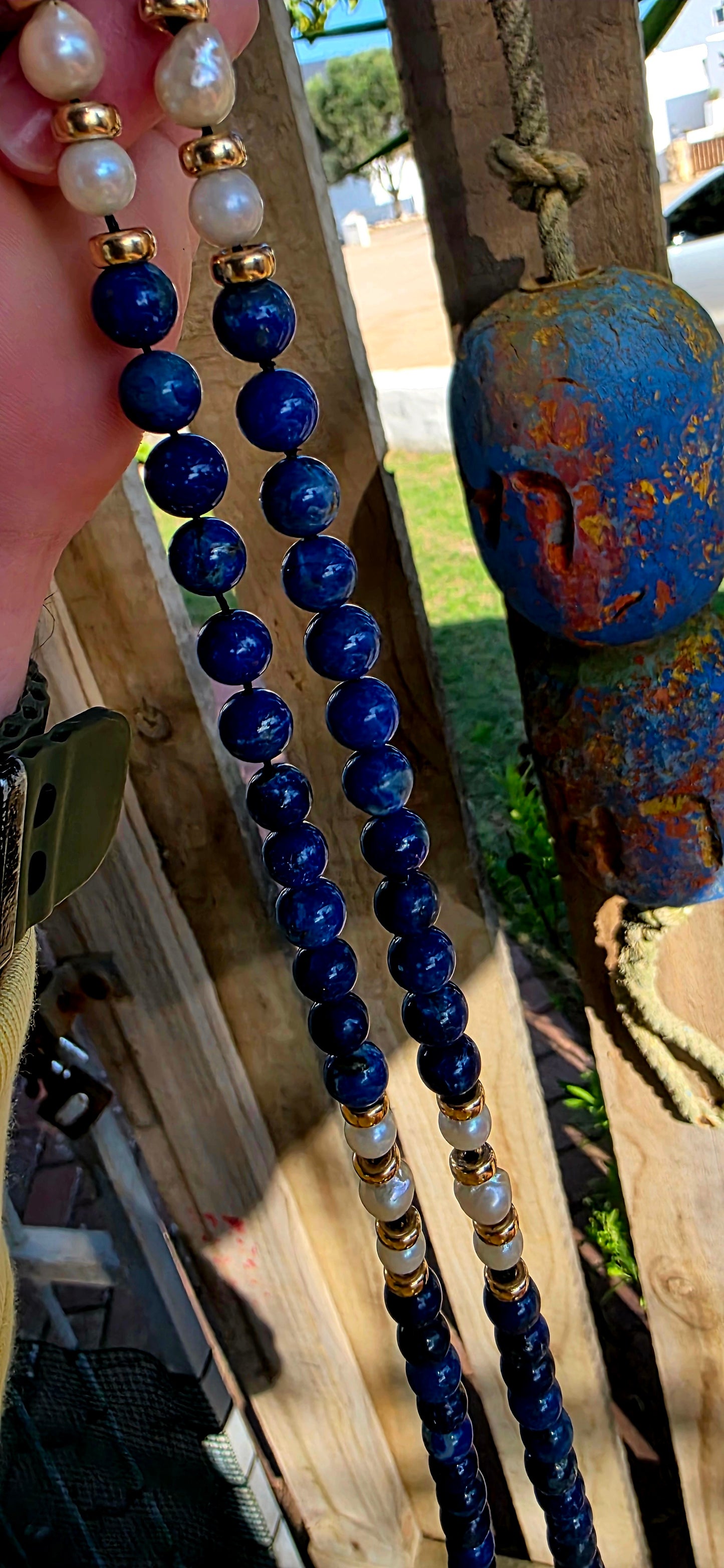 A striking statement piece that combines the rich blues of ancient royalty with the  elegance of pearls and gold.