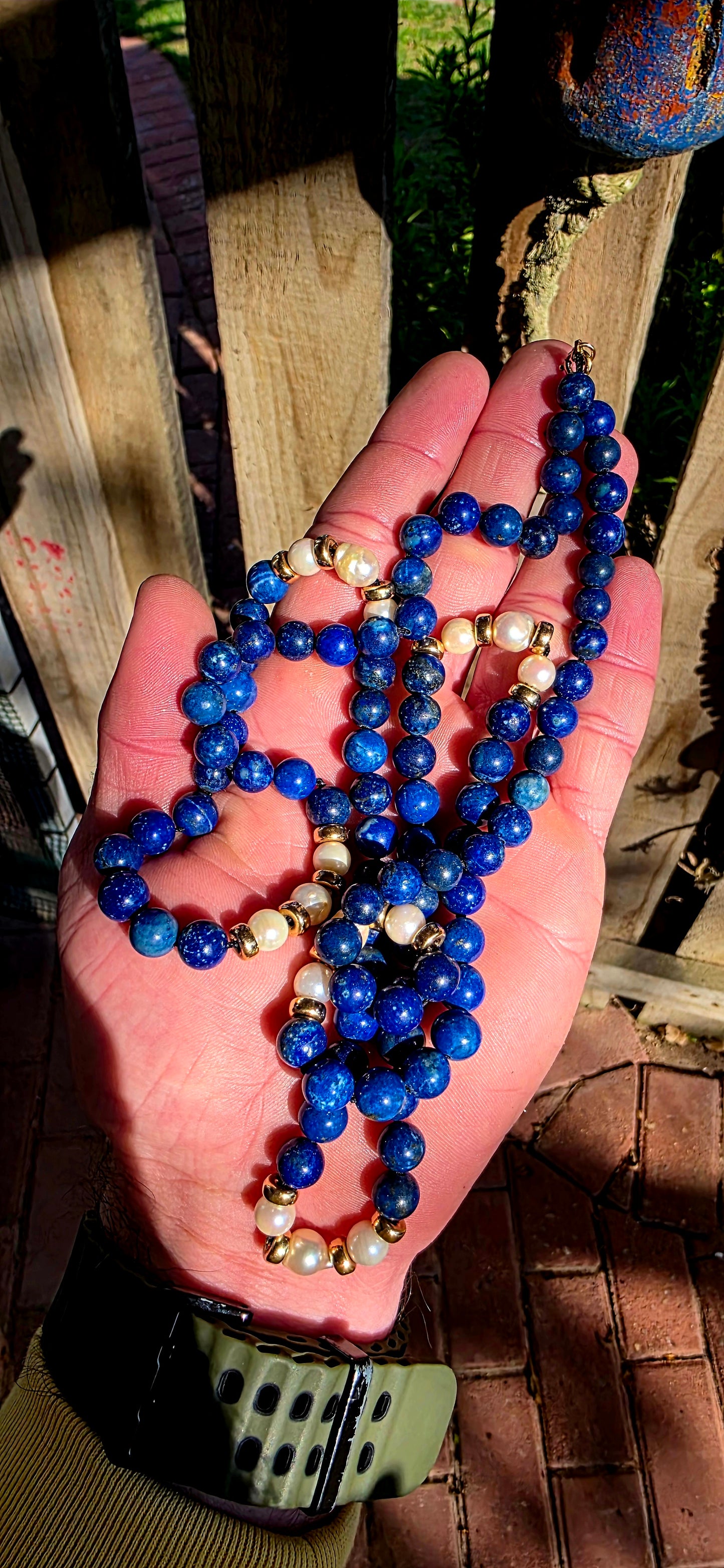 A striking statement piece that combines the rich blues of ancient royalty with the  elegance of pearls and gold.